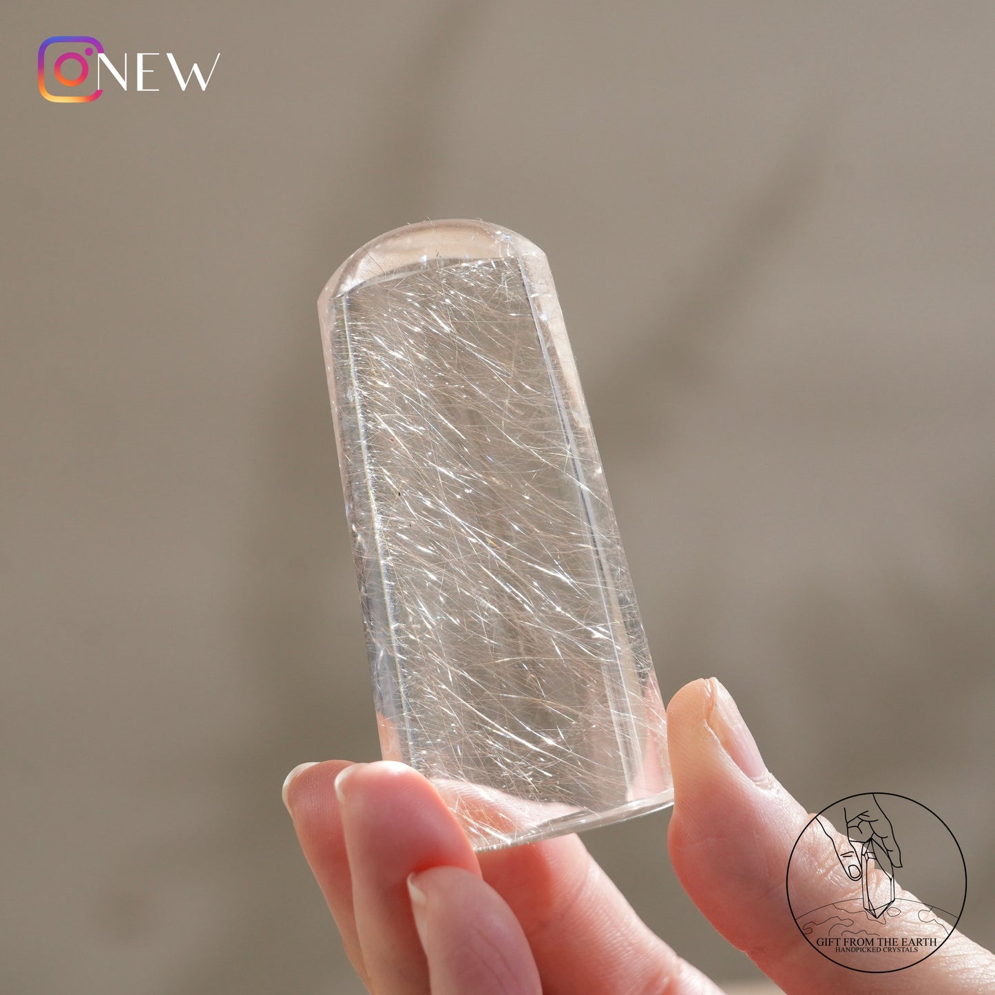 Silver rutilated quartz point