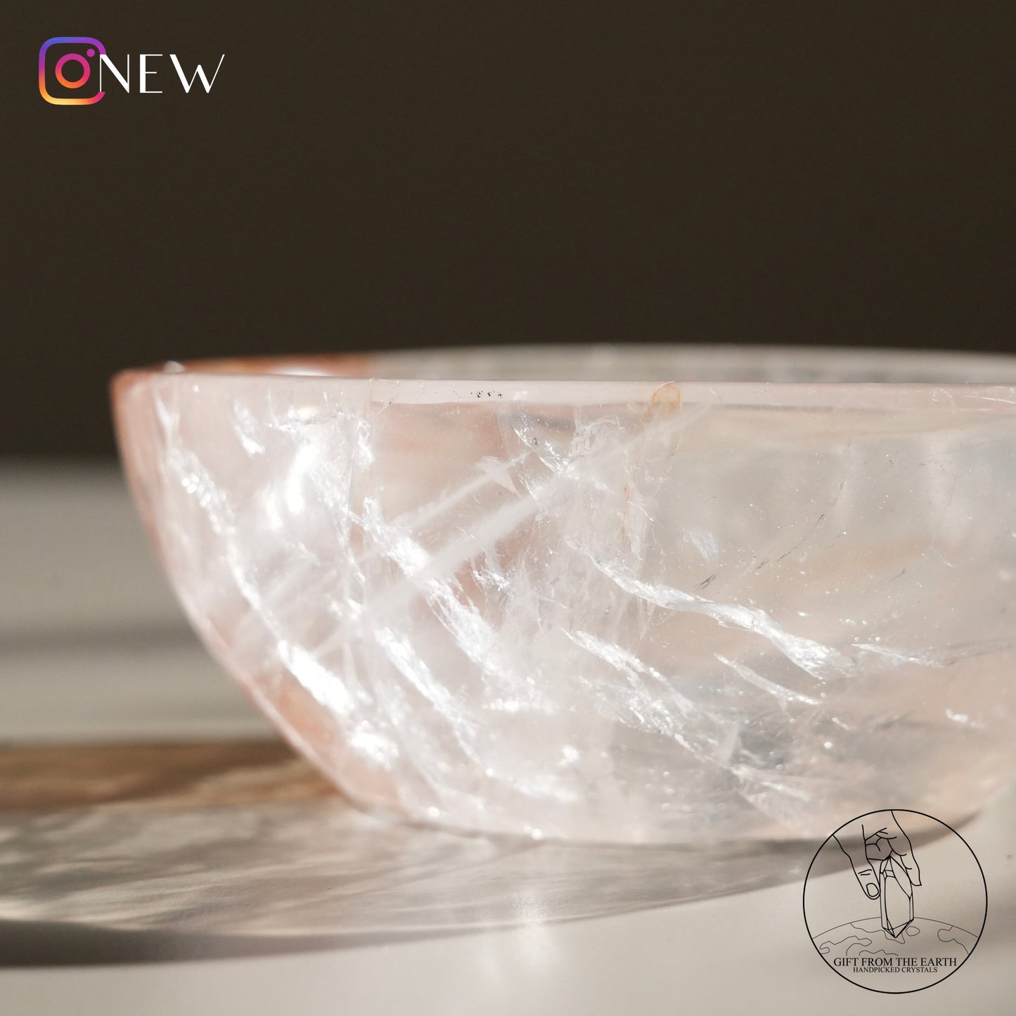 Clear quartz bowl with golden healer (pale pink)