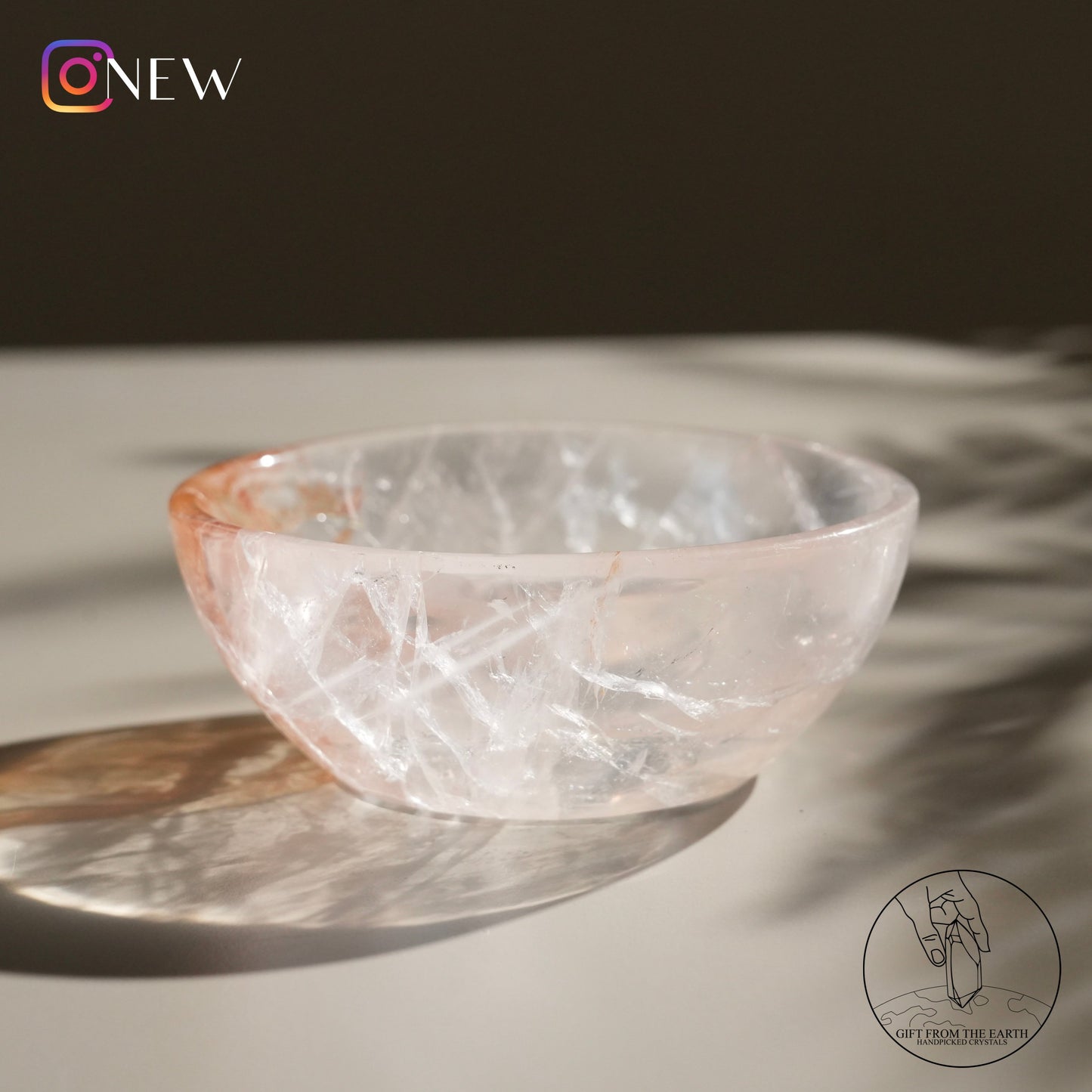 Clear quartz bowl with golden healer (pale pink)