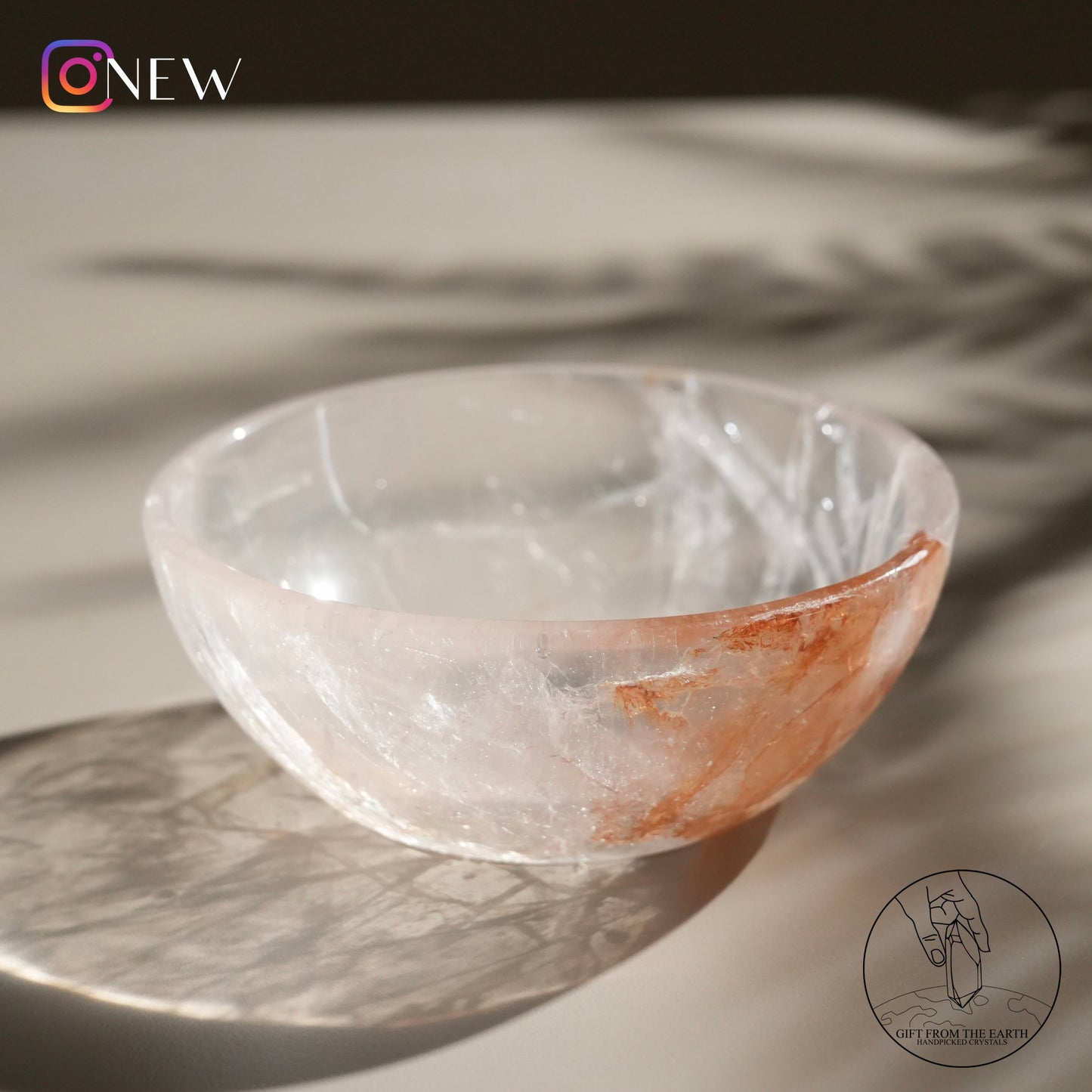 Clear quartz bowl with golden healer (pale pink)