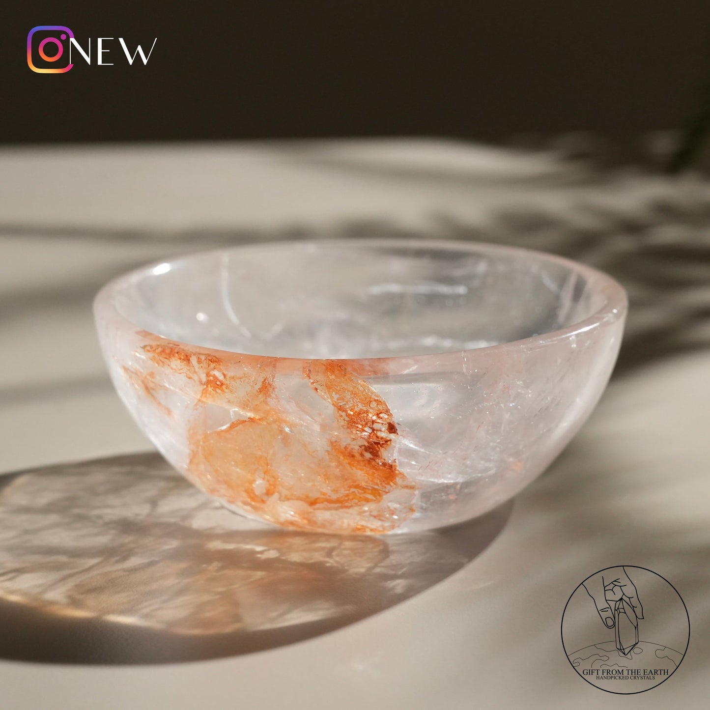 Clear quartz bowl with golden healer (pale pink)