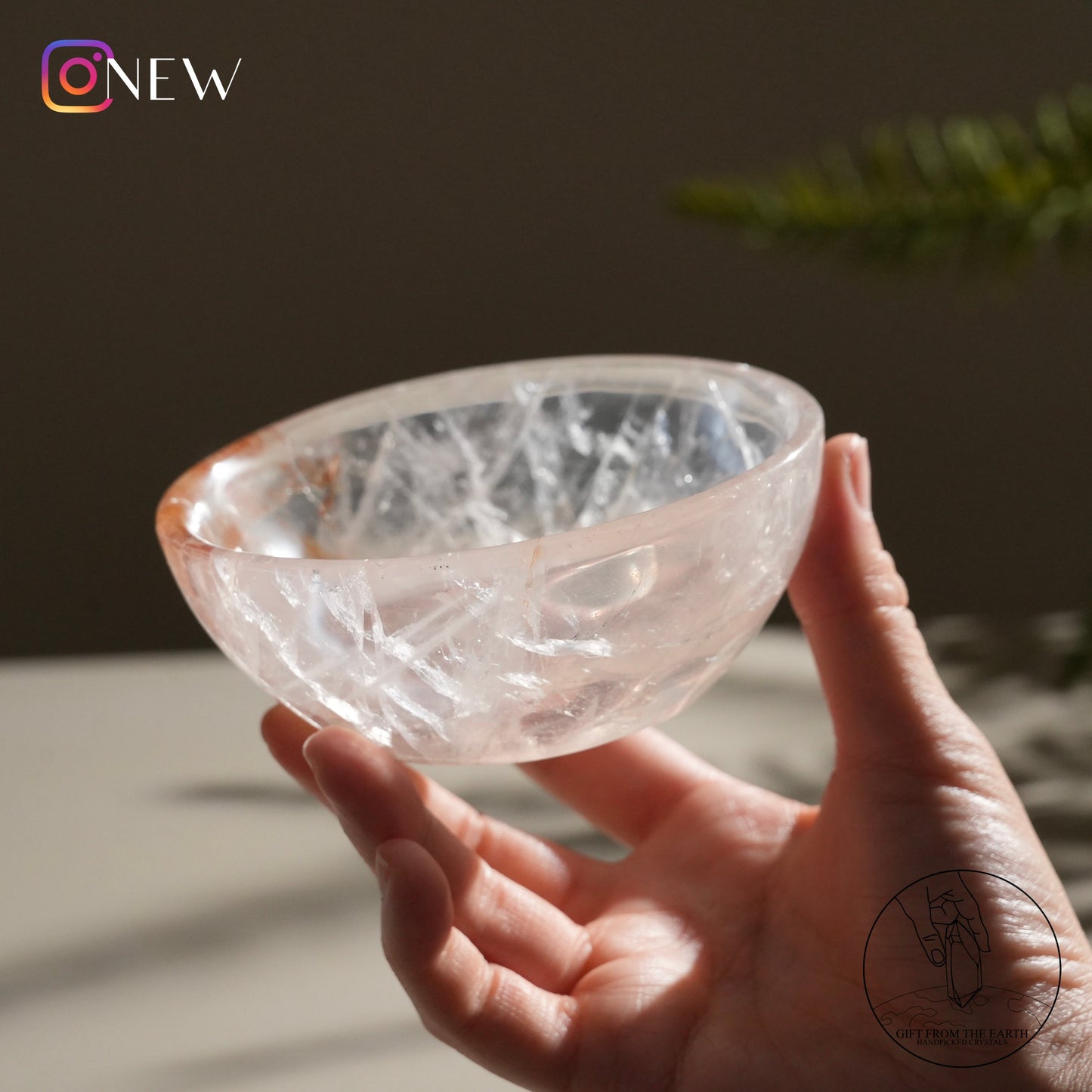 Clear quartz bowl with golden healer (pale pink)