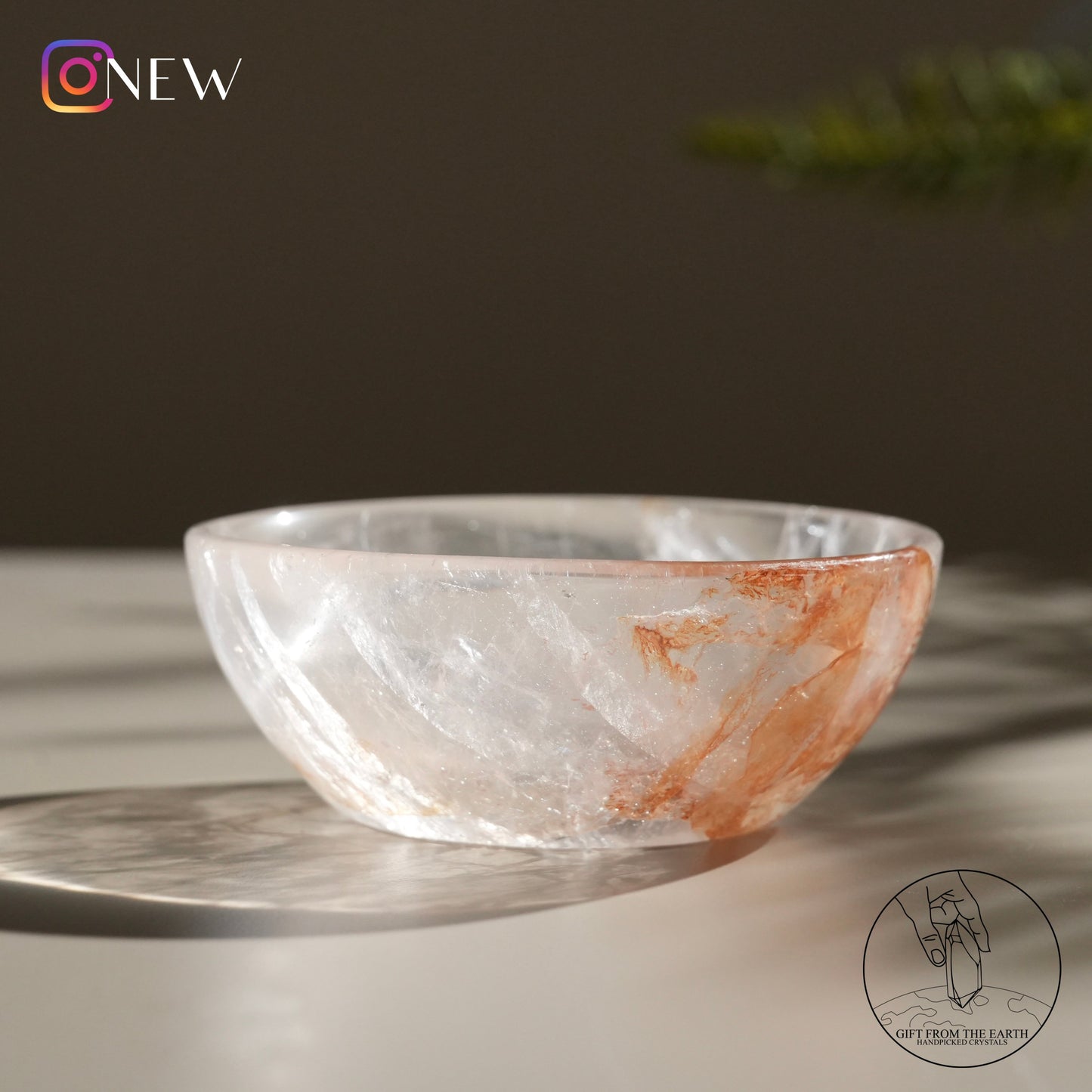 Clear quartz bowl with golden healer (pale pink)