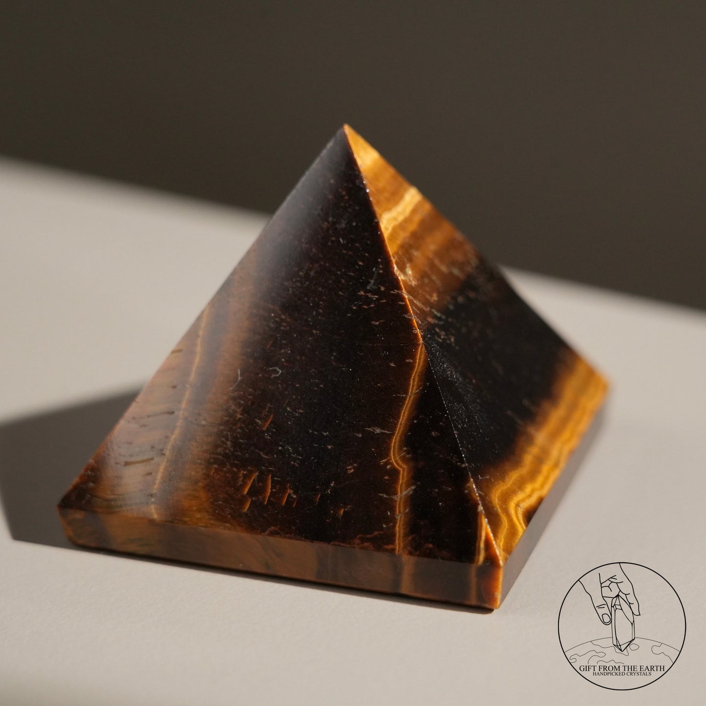 Yellow tiger's eye pyramid