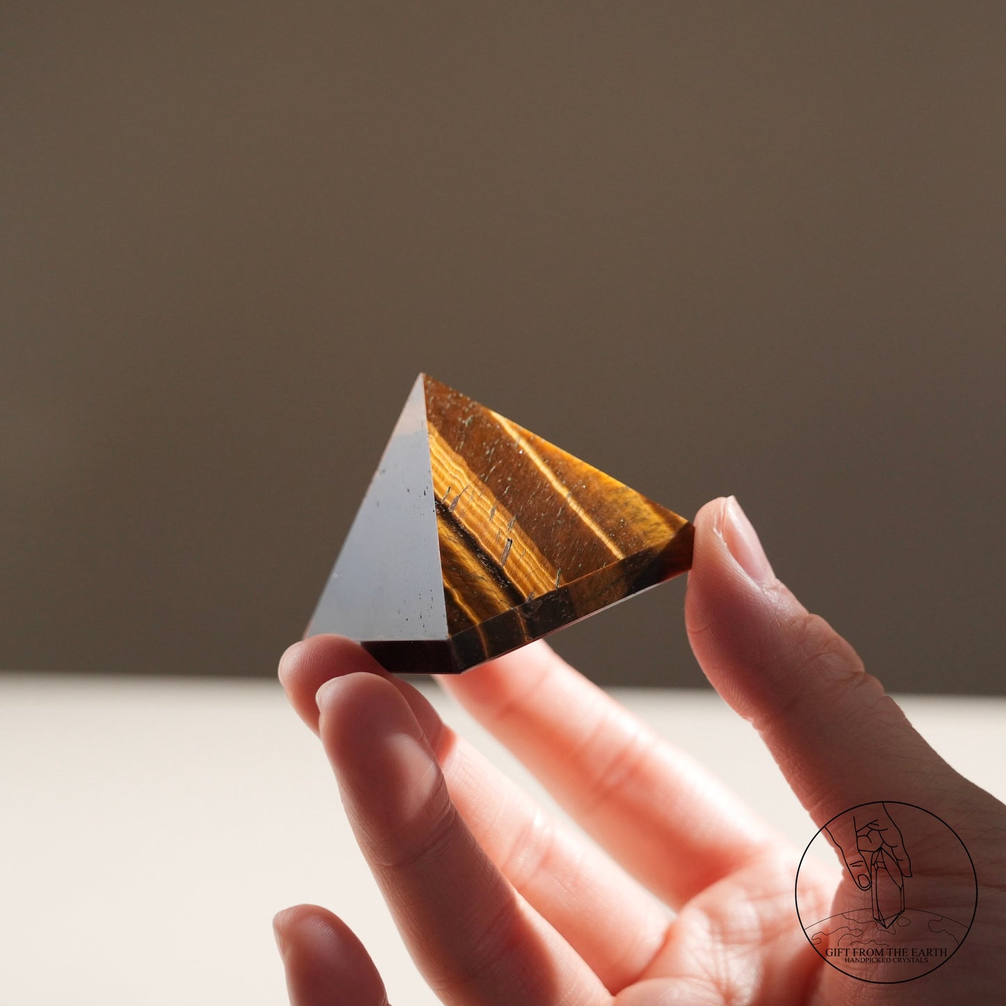 Yellow tiger's eye pyramid