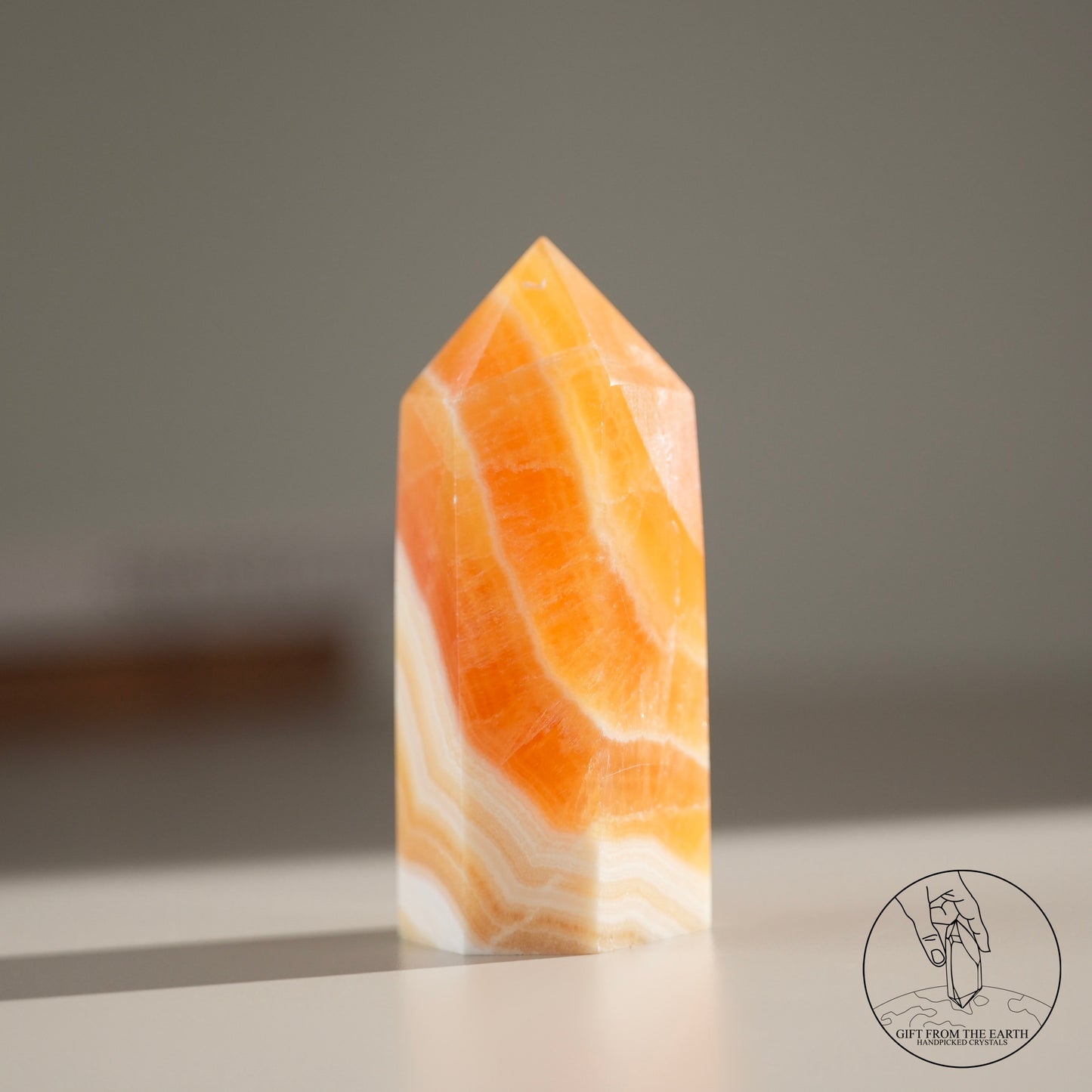 Orange calcite point