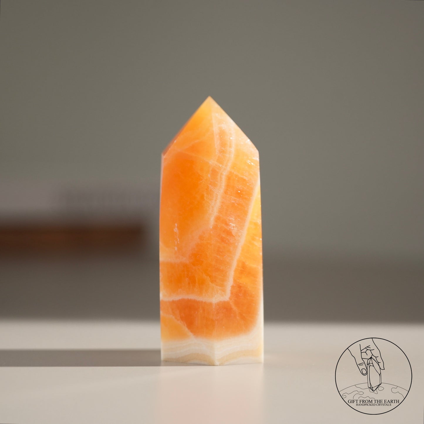 Orange calcite point