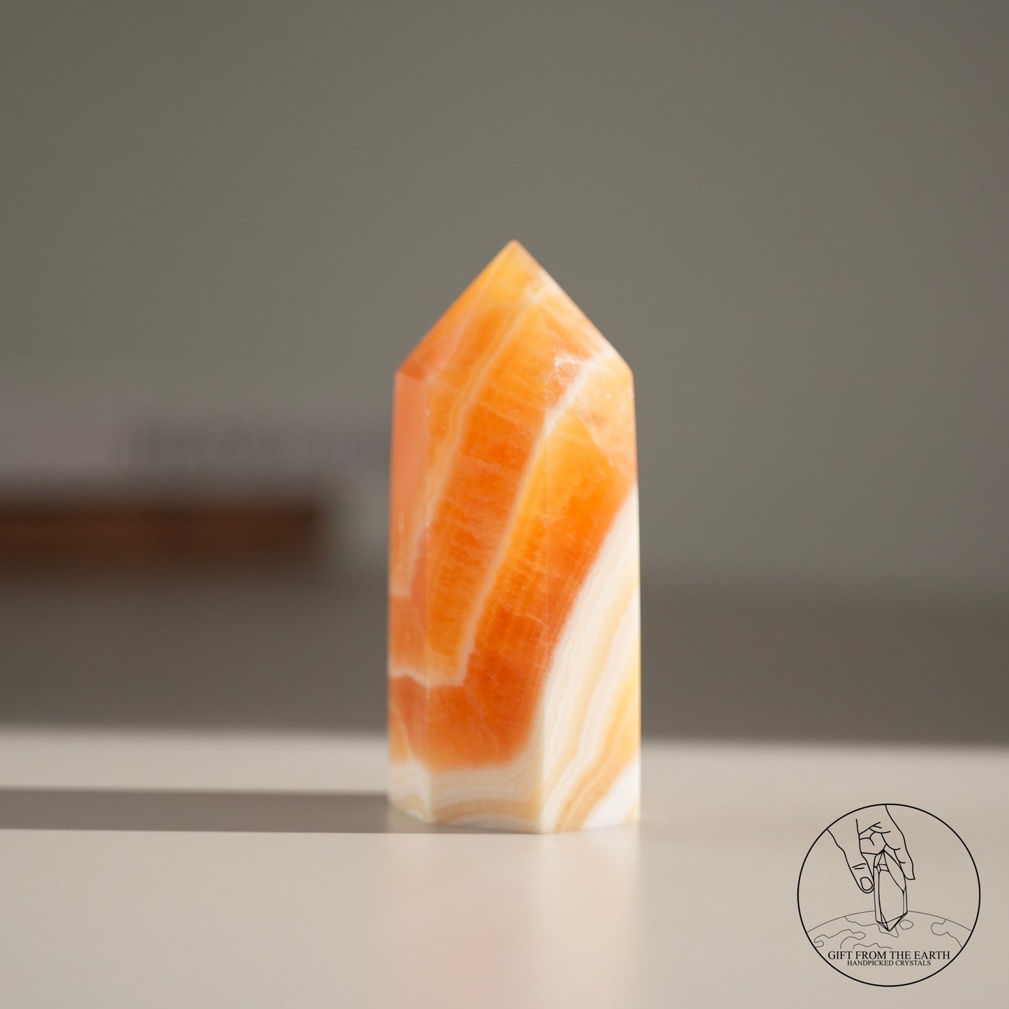 Orange calcite point