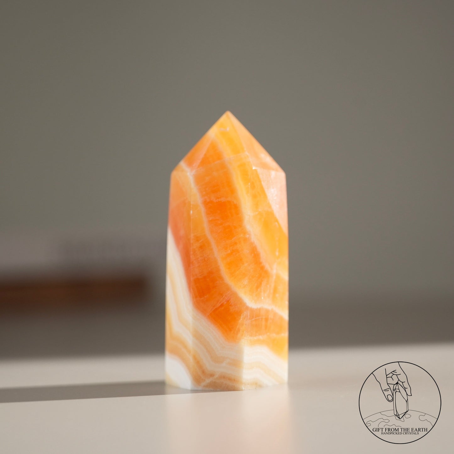 Orange calcite point