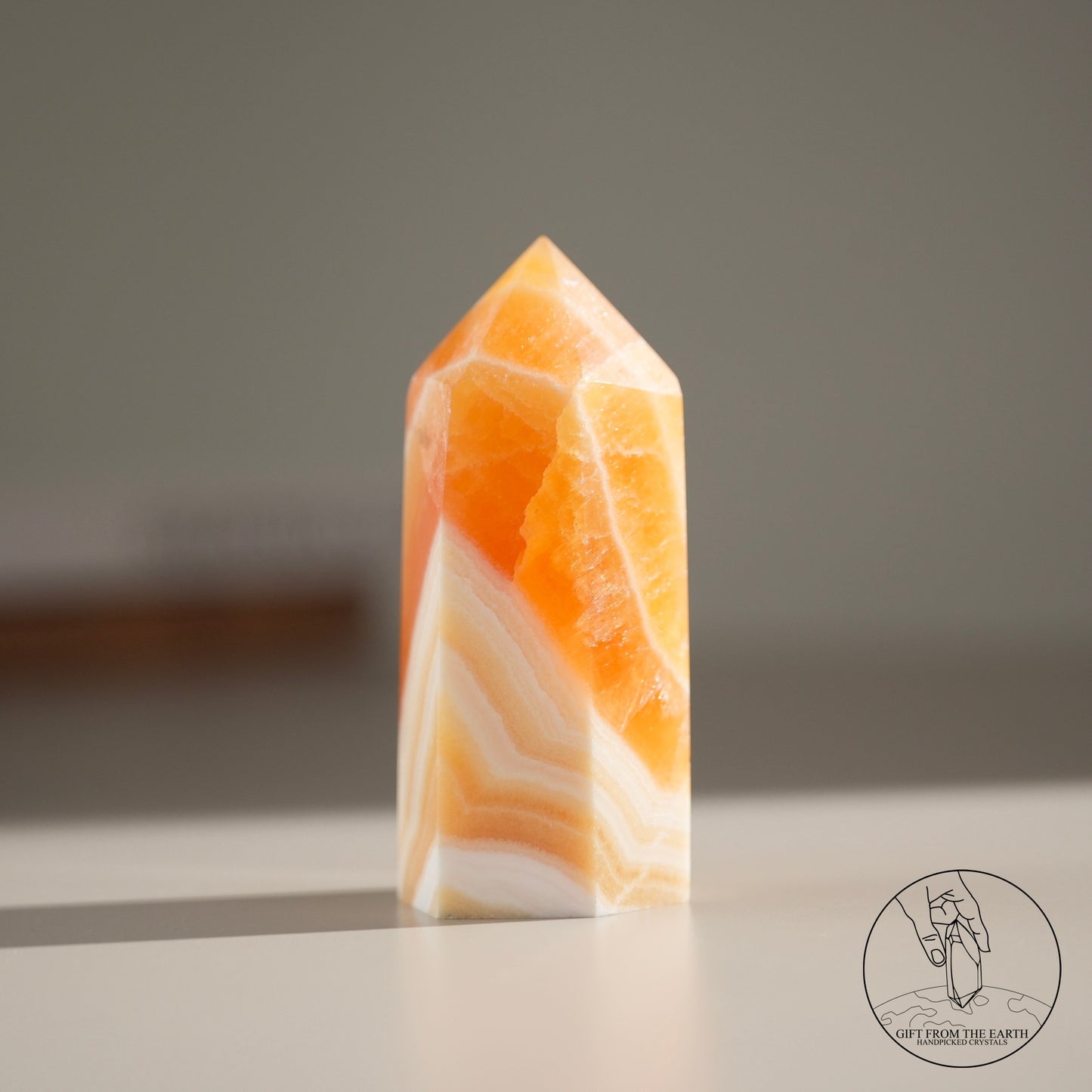 Orange calcite point