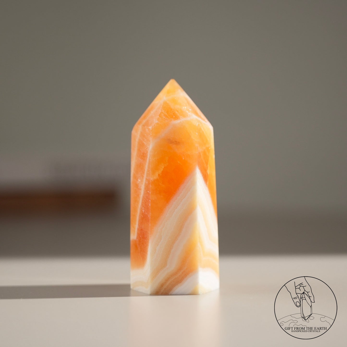 Orange calcite point