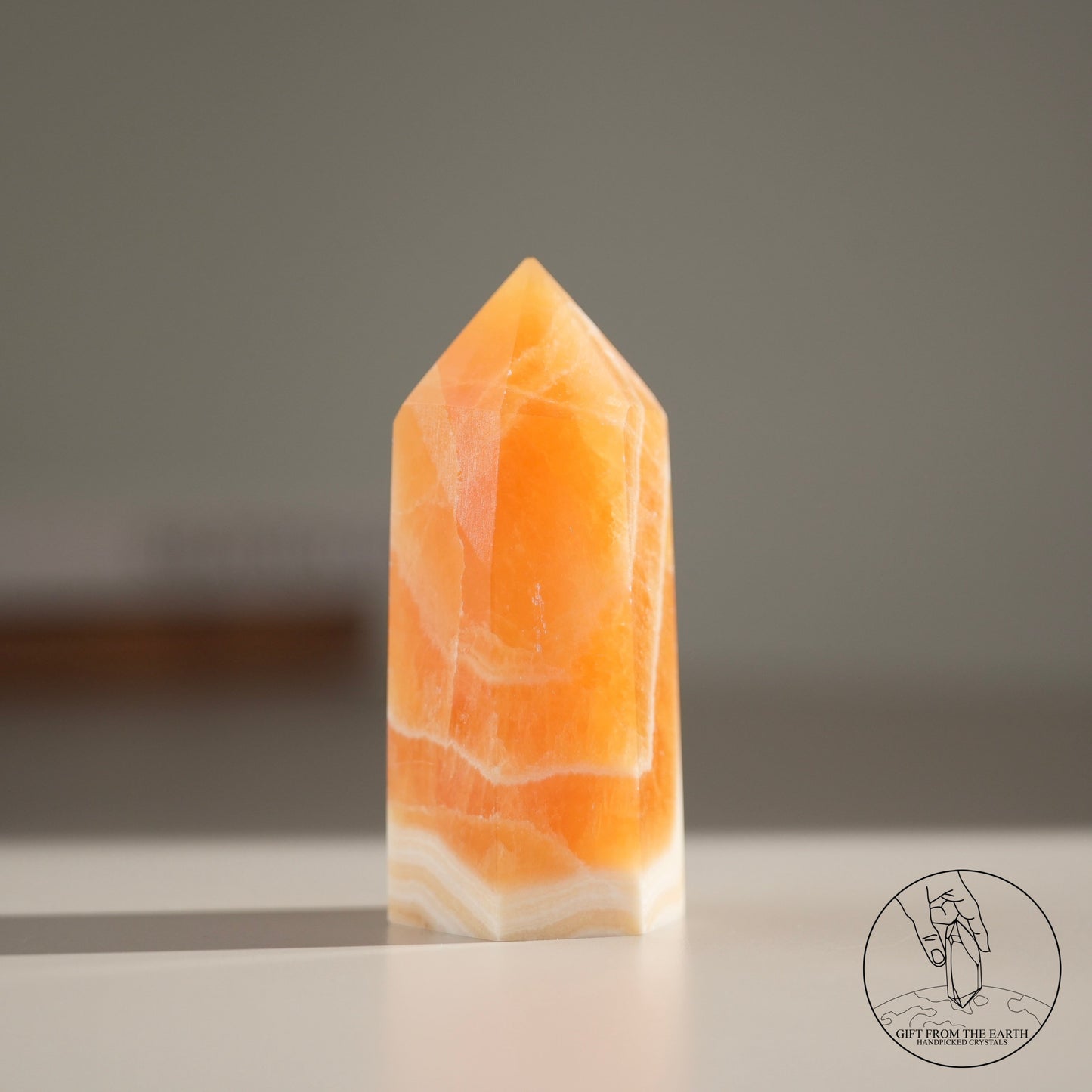 Orange calcite point