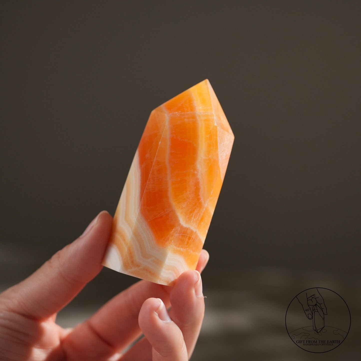 Orange calcite point