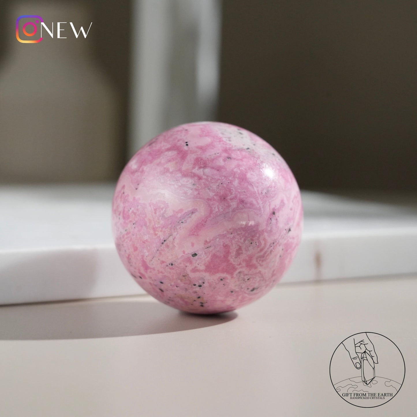 Peruvian rhodochrosite sphere