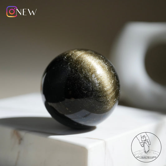 Golden obsidian sphere