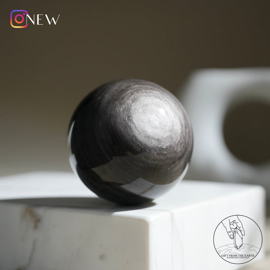 Silver sheen obsidian sphere