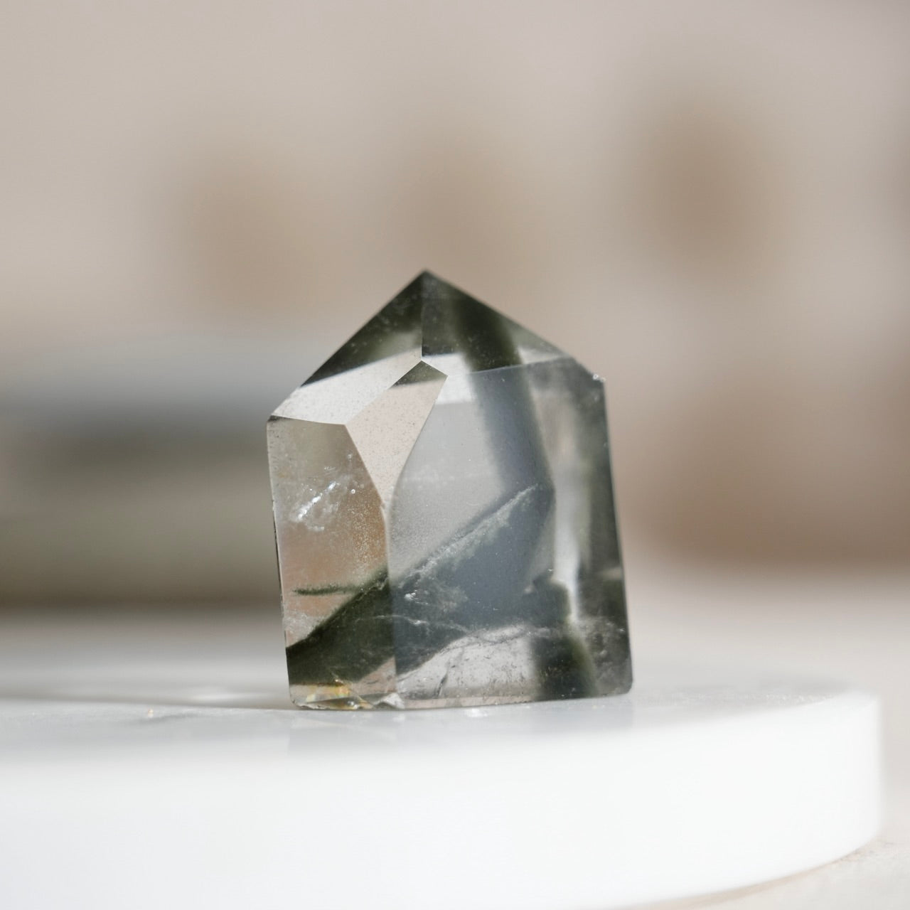 Half-polished multi-layered red-green phantom quartz point