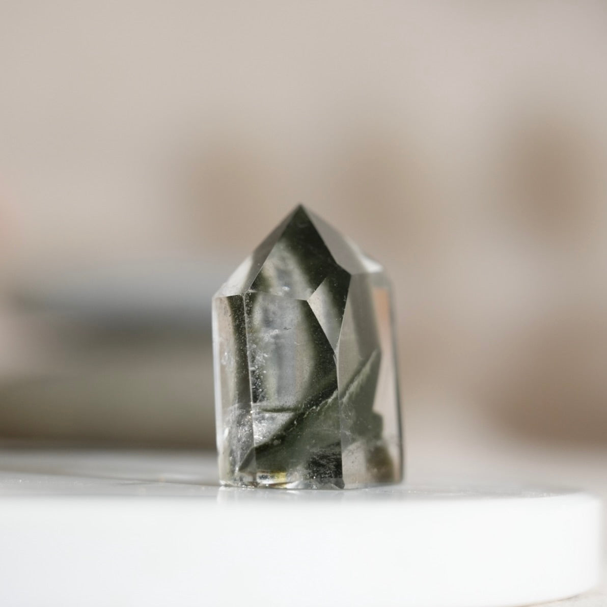 Half-polished multi-layered red-green phantom quartz point