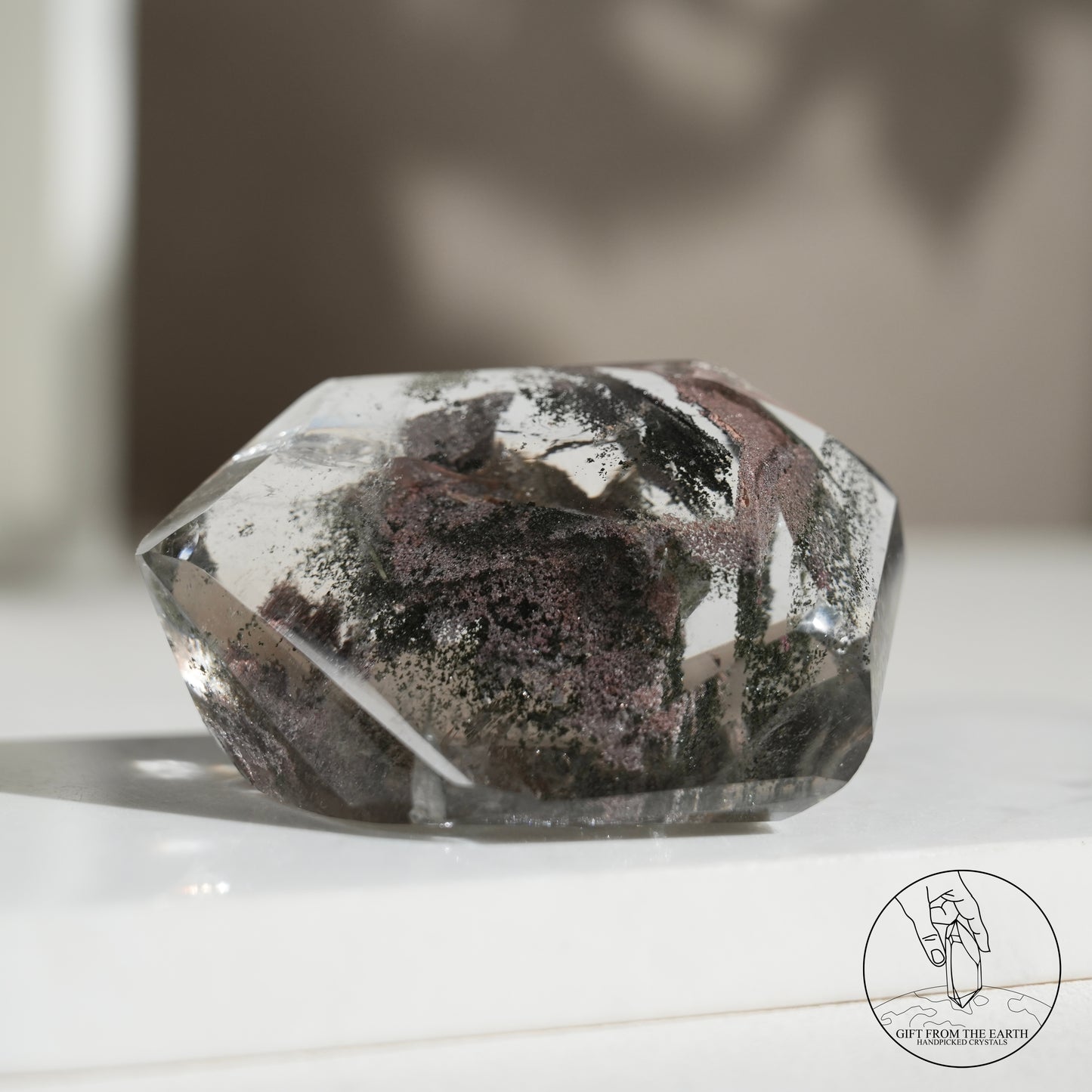 Half-polished multi-layered red-green phantom quartz point