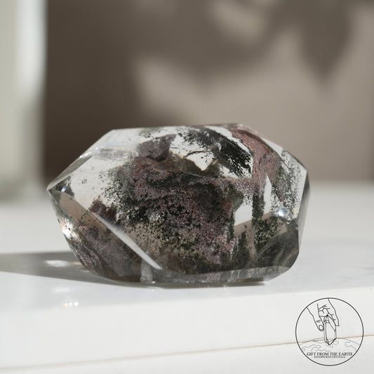 Half-polished multi-layered red-green phantom quartz point