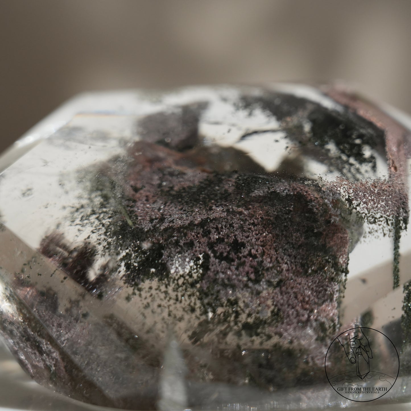 Half-polished multi-layered red-green phantom quartz point