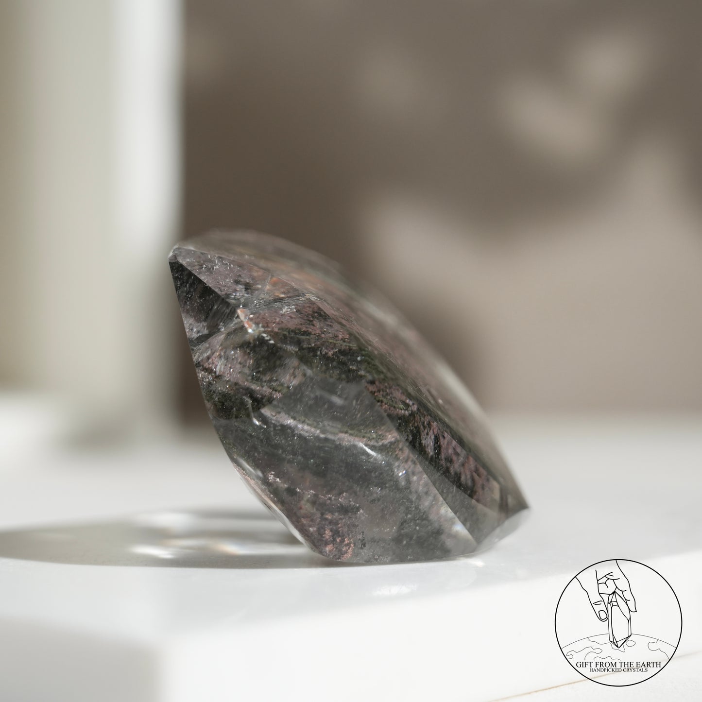 Half-polished multi-layered red-green phantom quartz point