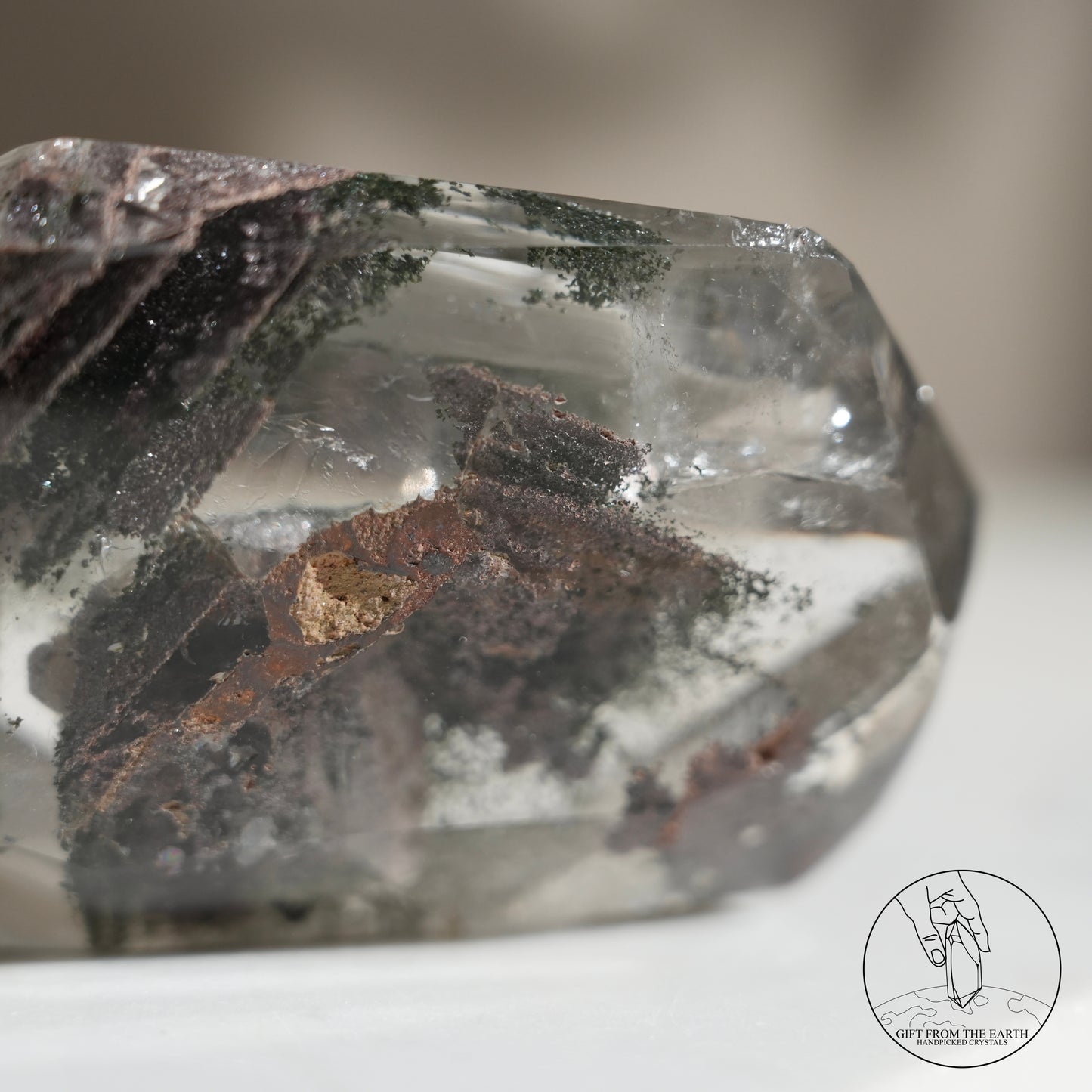 Half-polished multi-layered red-green phantom quartz point