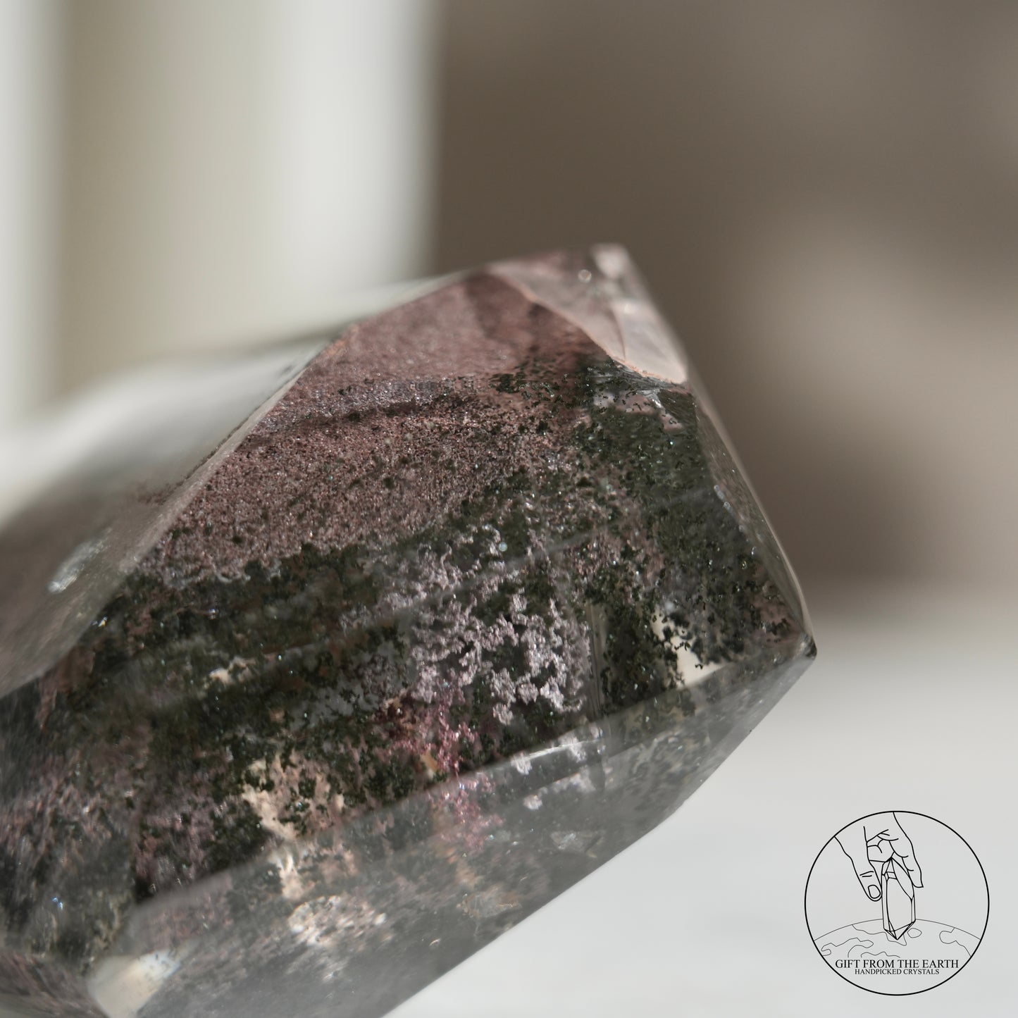 Half-polished multi-layered red-green phantom quartz point