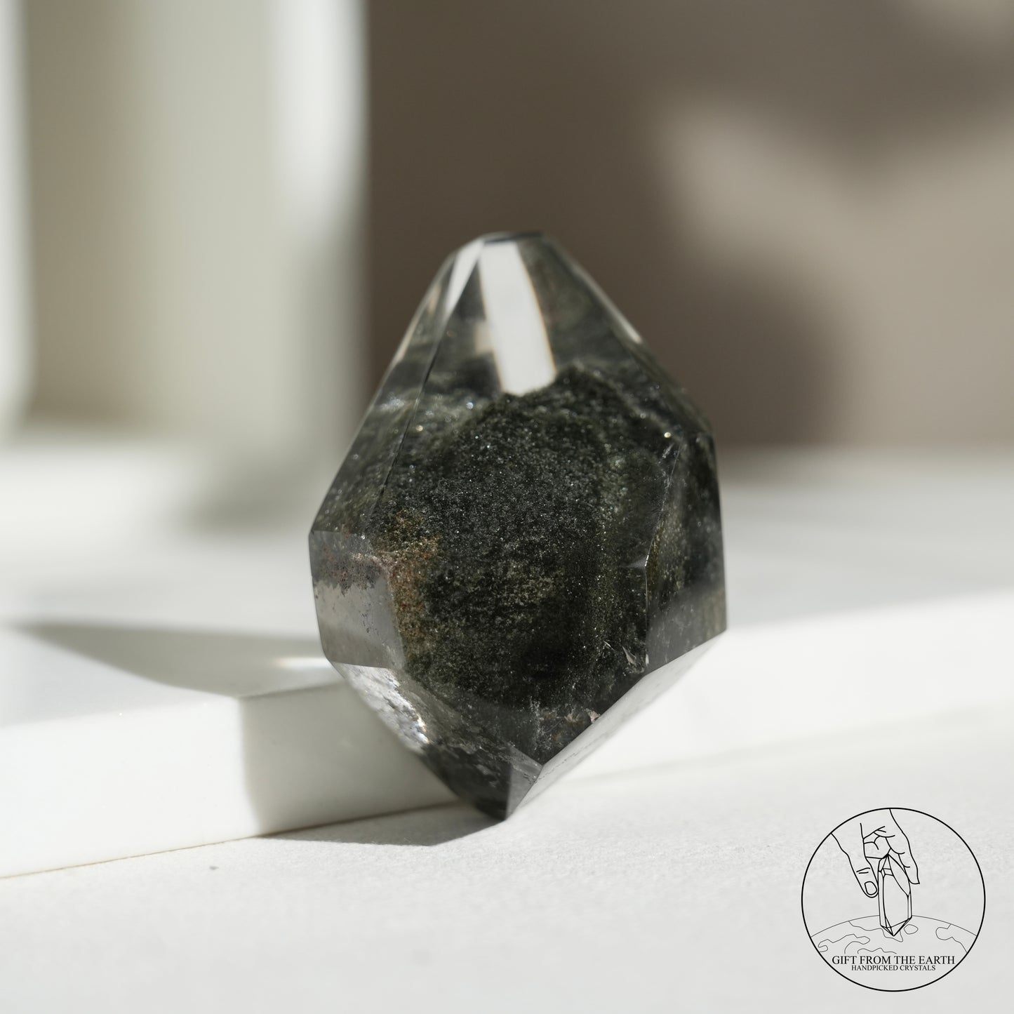 Half-polished multi-layered red-green phantom quartz point