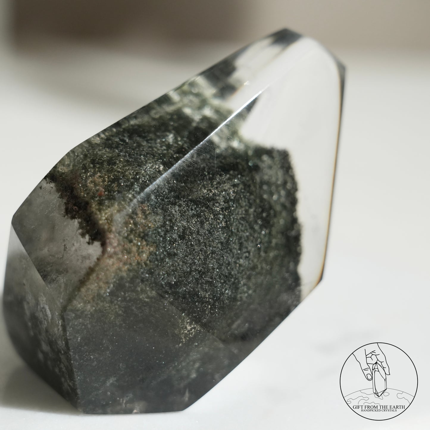 Half-polished multi-layered red-green phantom quartz point