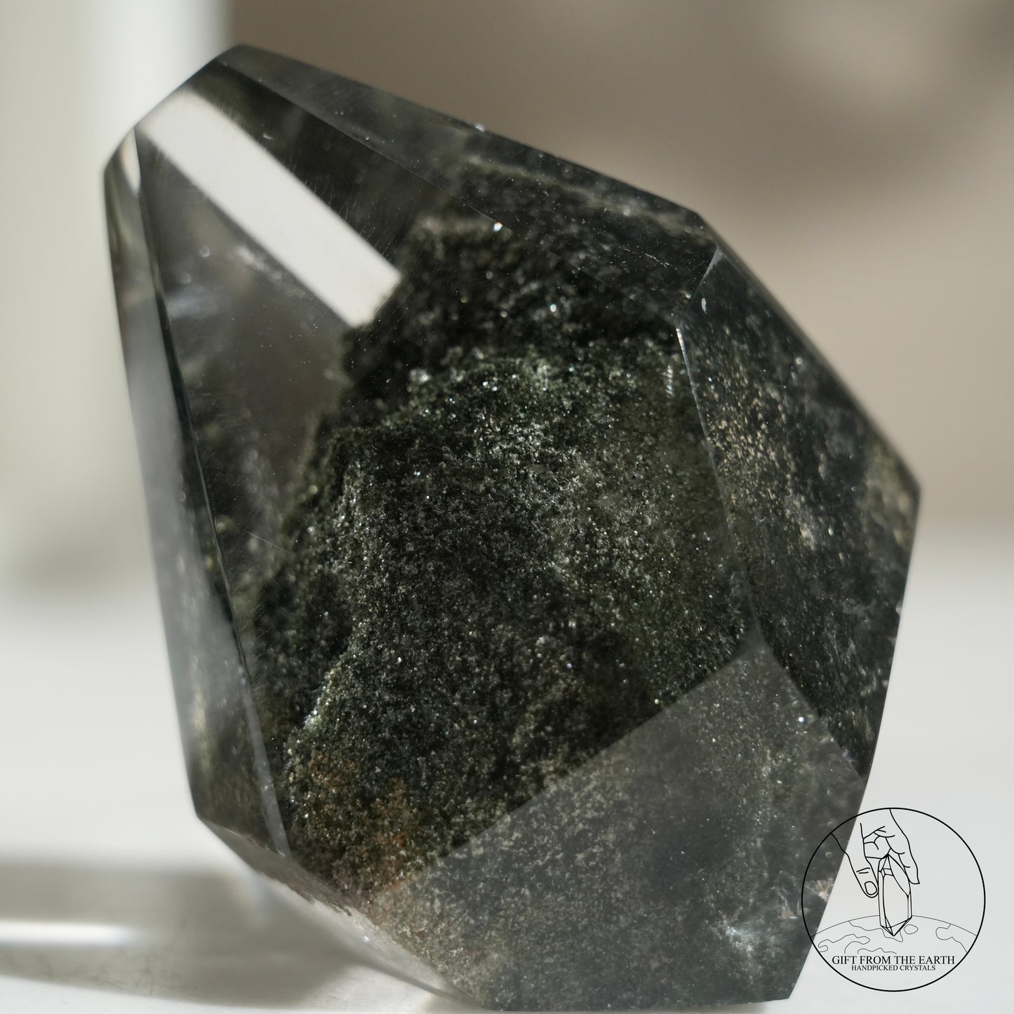 Half-polished multi-layered red-green phantom quartz point