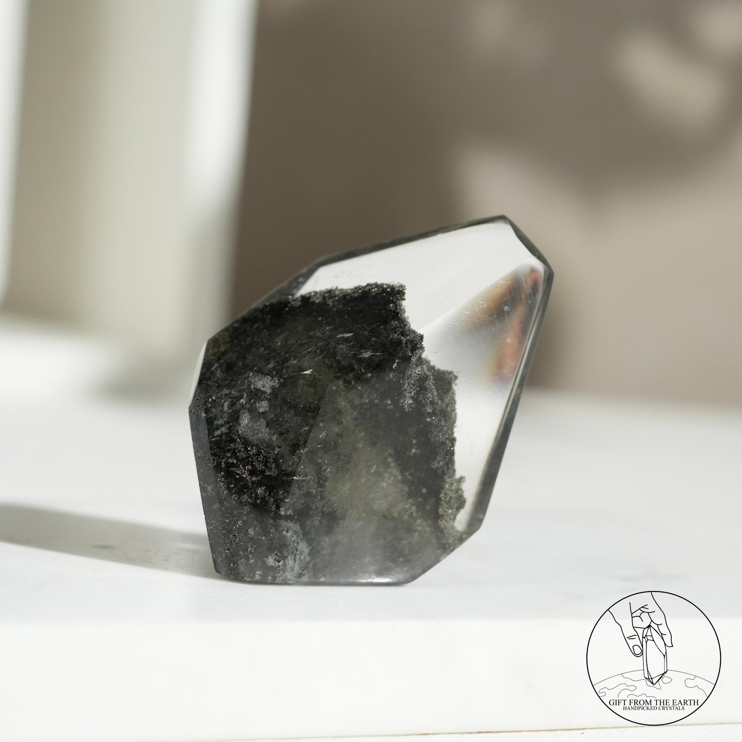 Half-polished multi-layered red-green phantom quartz point