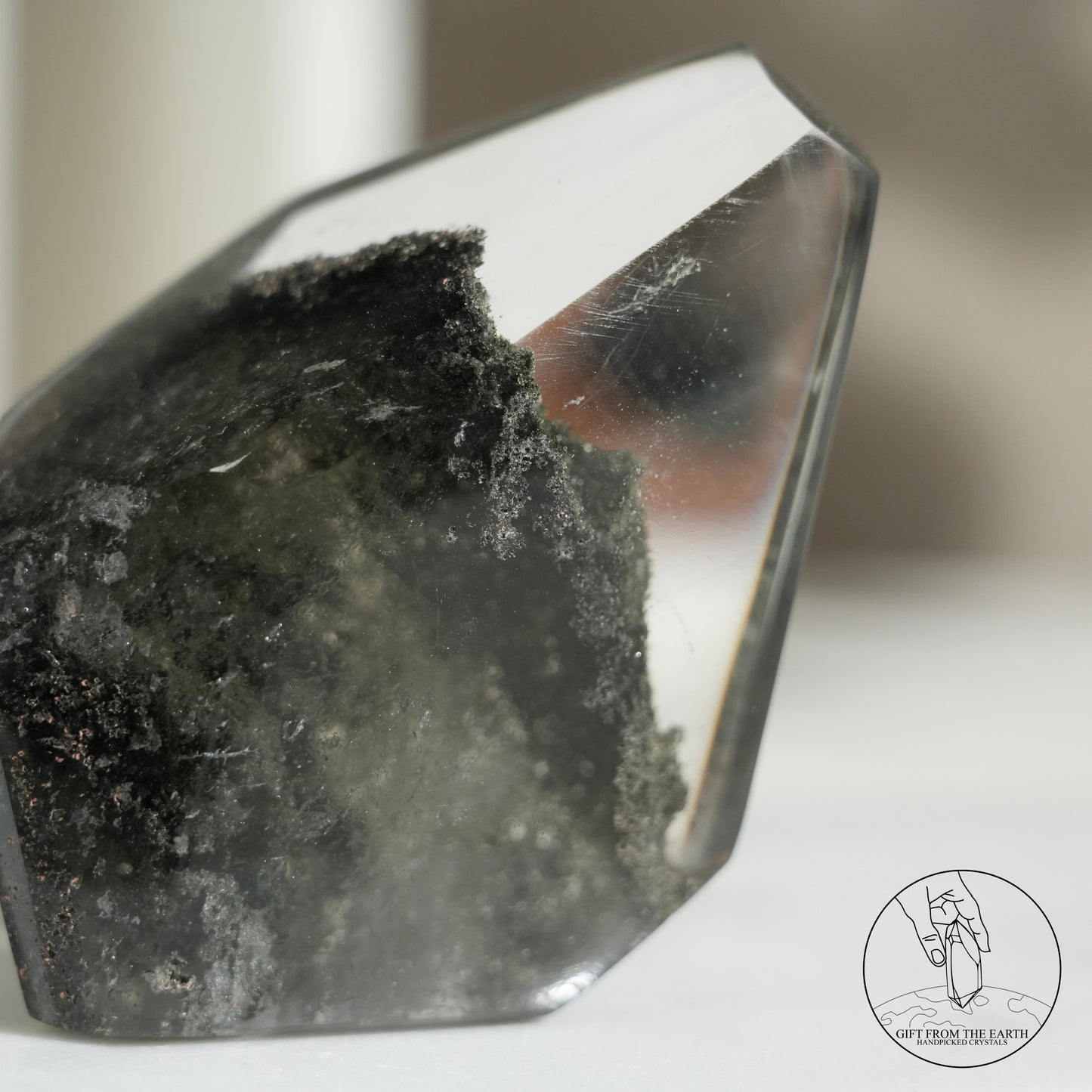 Half-polished multi-layered red-green phantom quartz point