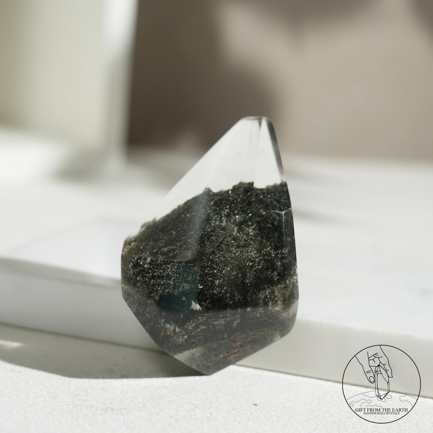 Half-polished multi-layered red-green phantom quartz point