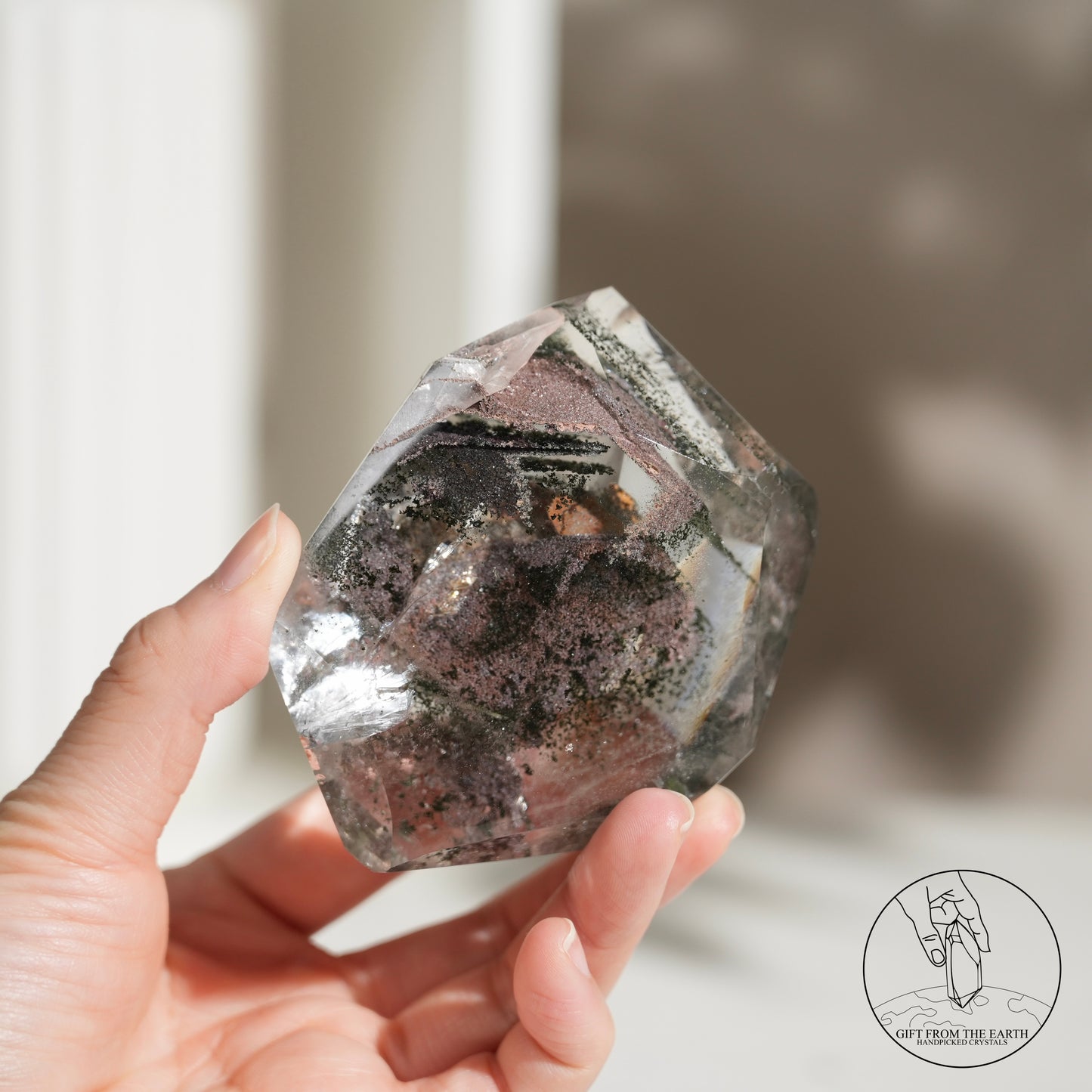 Half-polished multi-layered red-green phantom quartz point