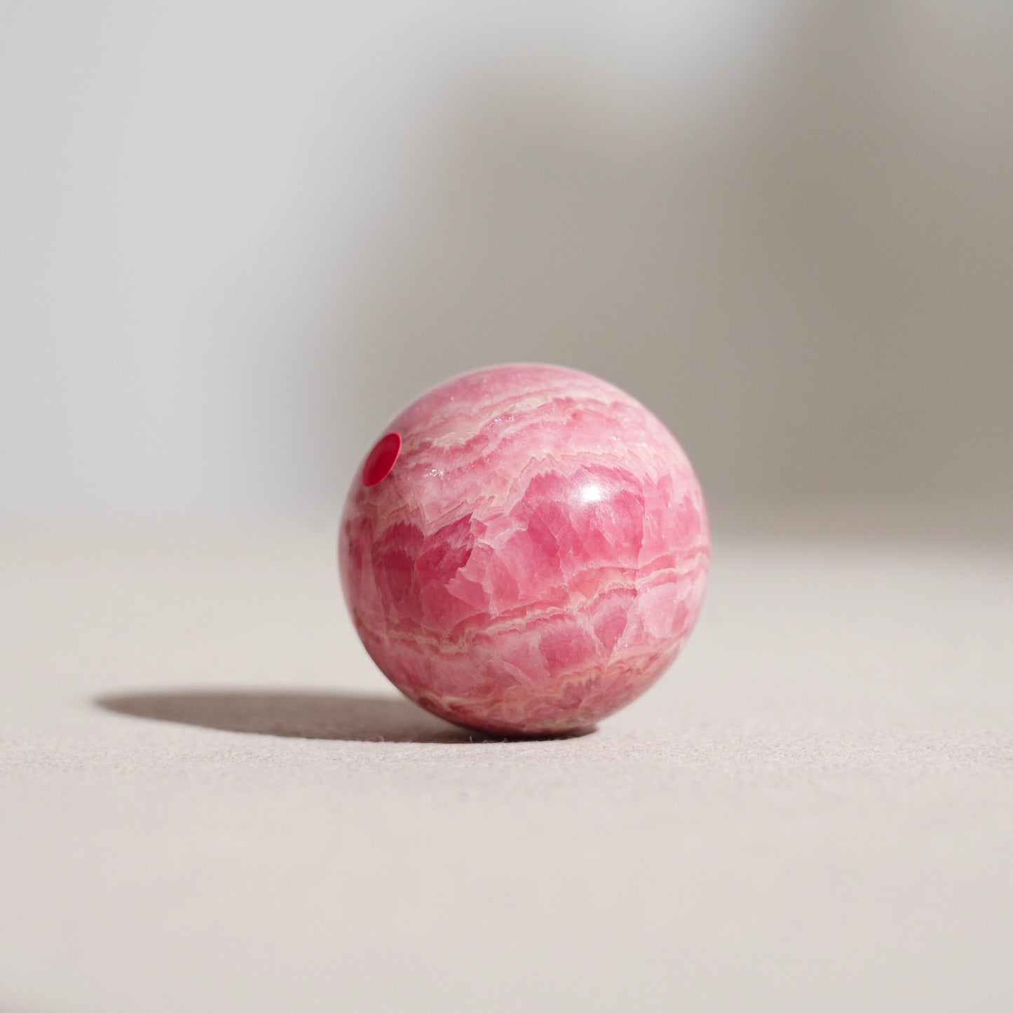 Peruvian rhodochrosite sphere