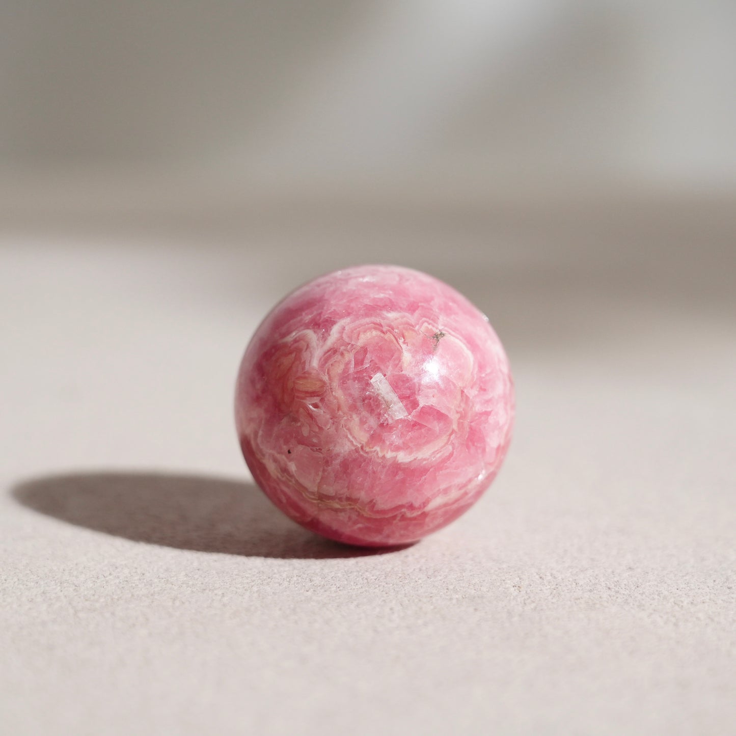 Peruvian rhodochrosite sphere