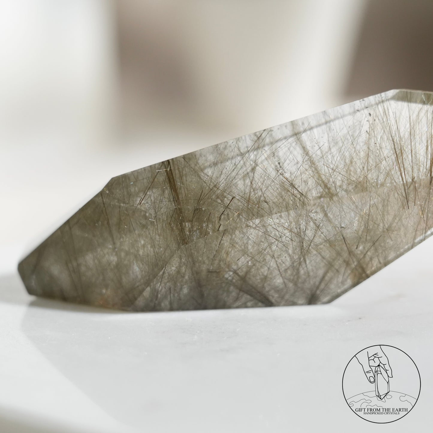 Green rutilated quartz sphere