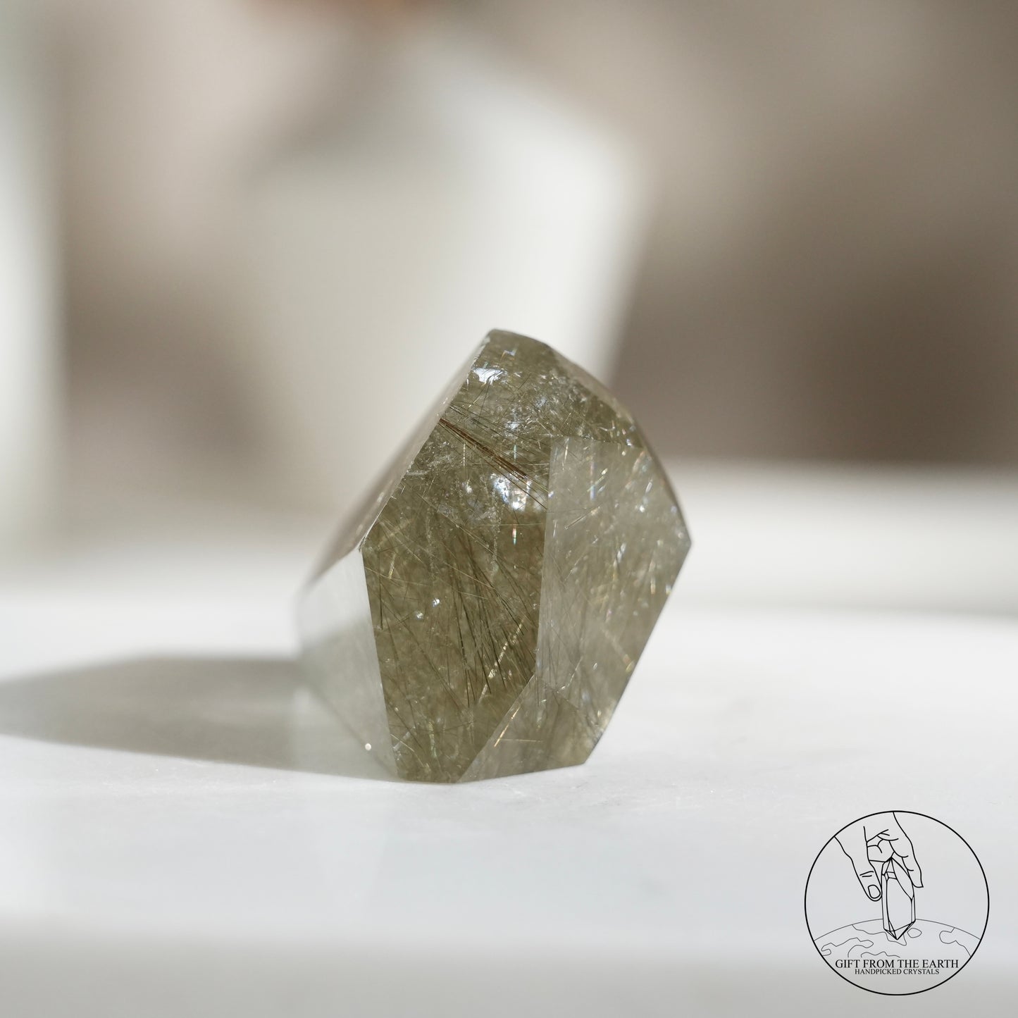 Green rutilated quartz sphere
