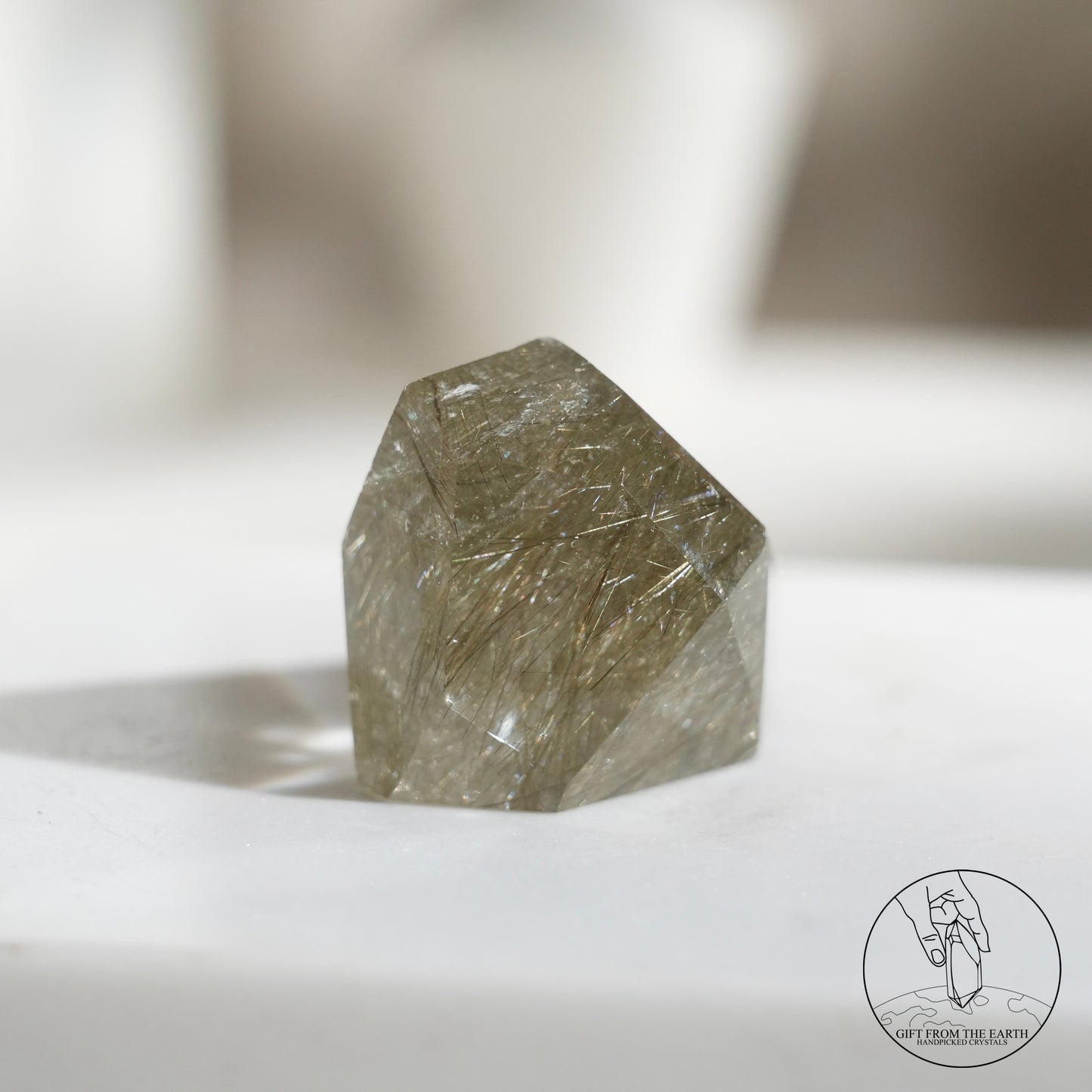 Green rutilated quartz sphere