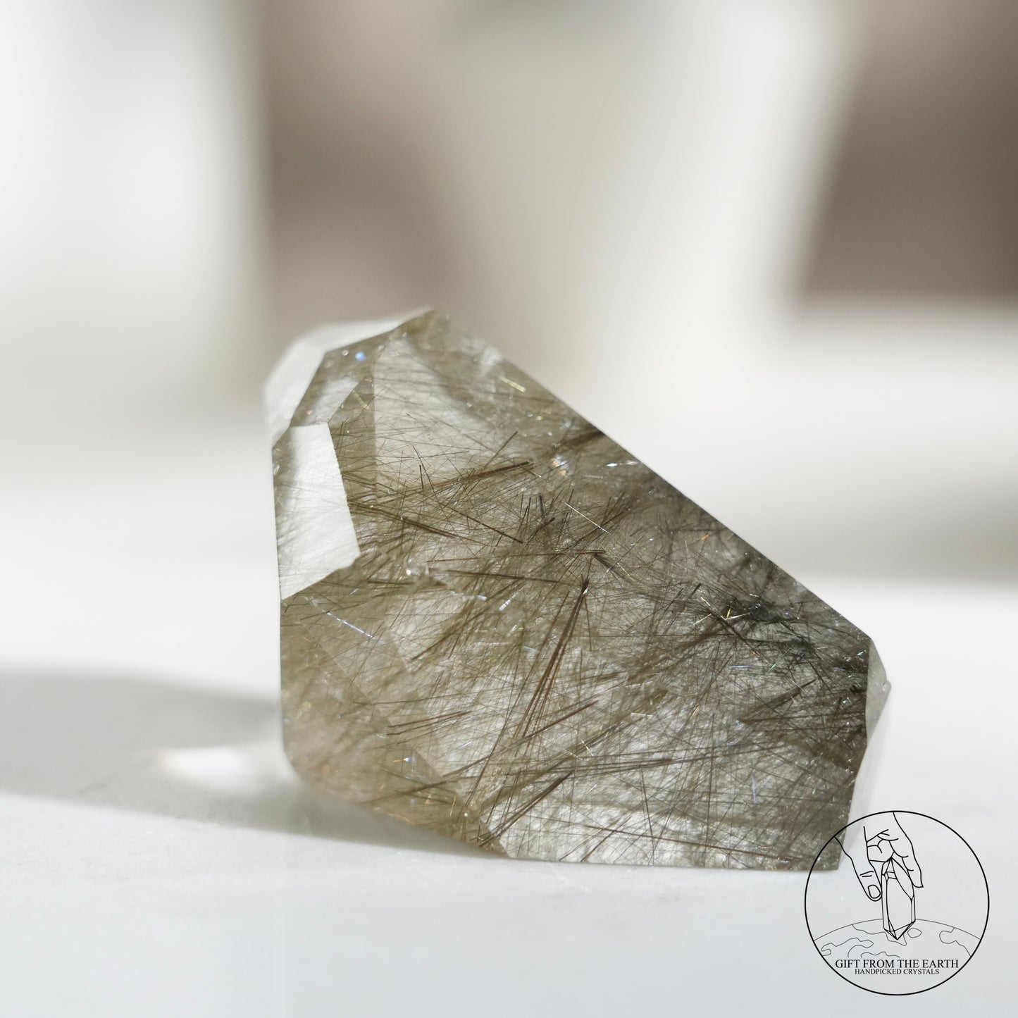 Green rutilated quartz sphere