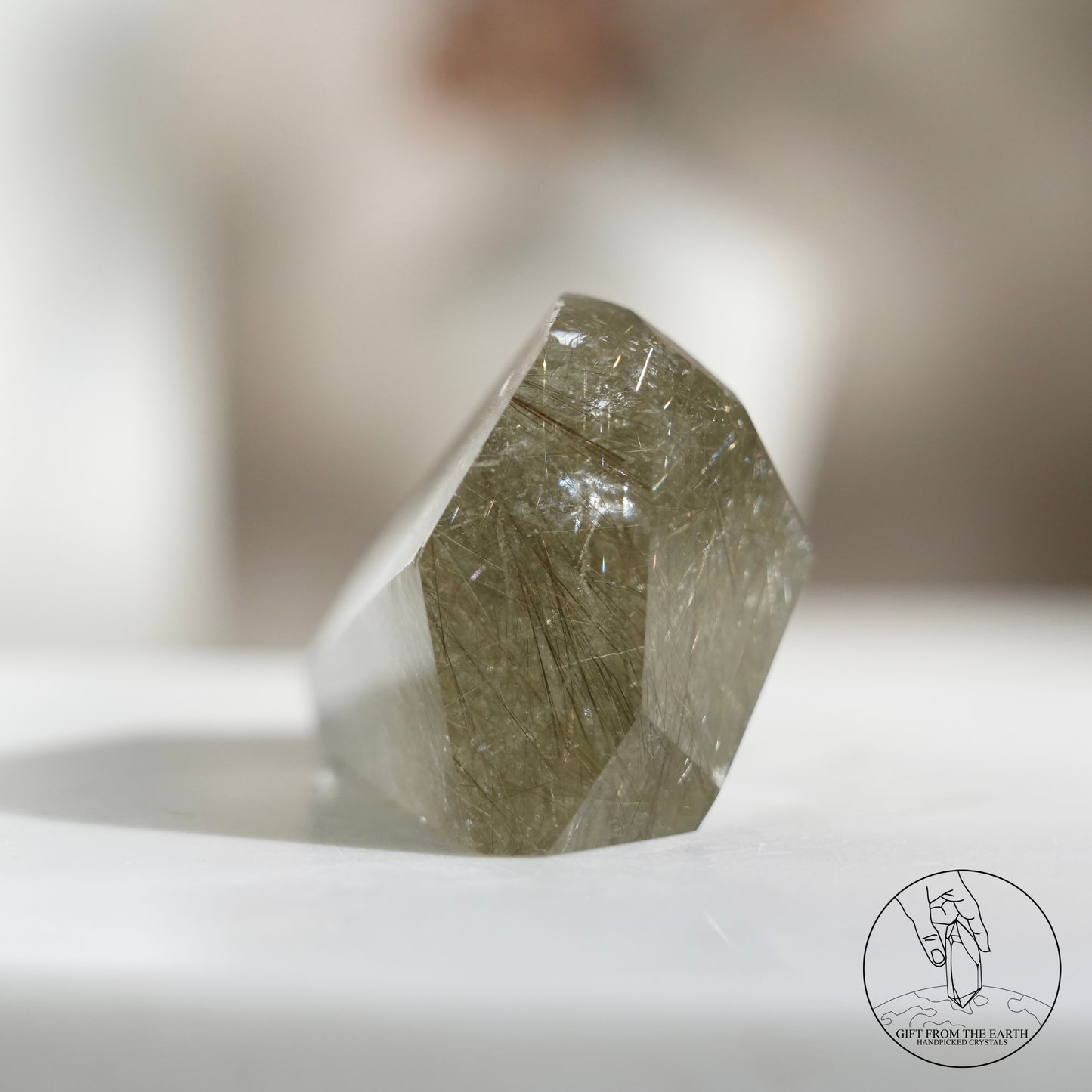 Green rutilated quartz sphere