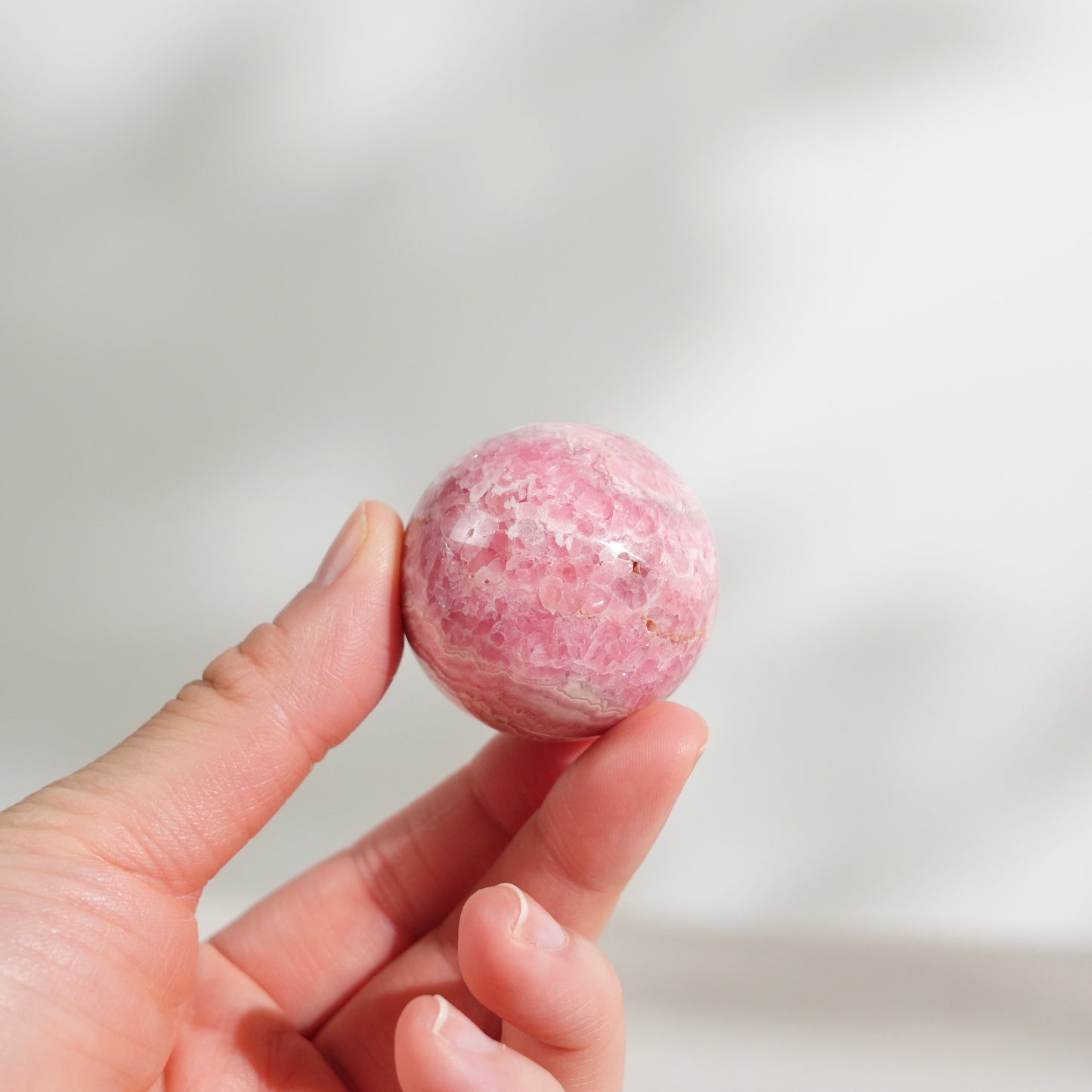 Peruvian rhodochrosite sphere
