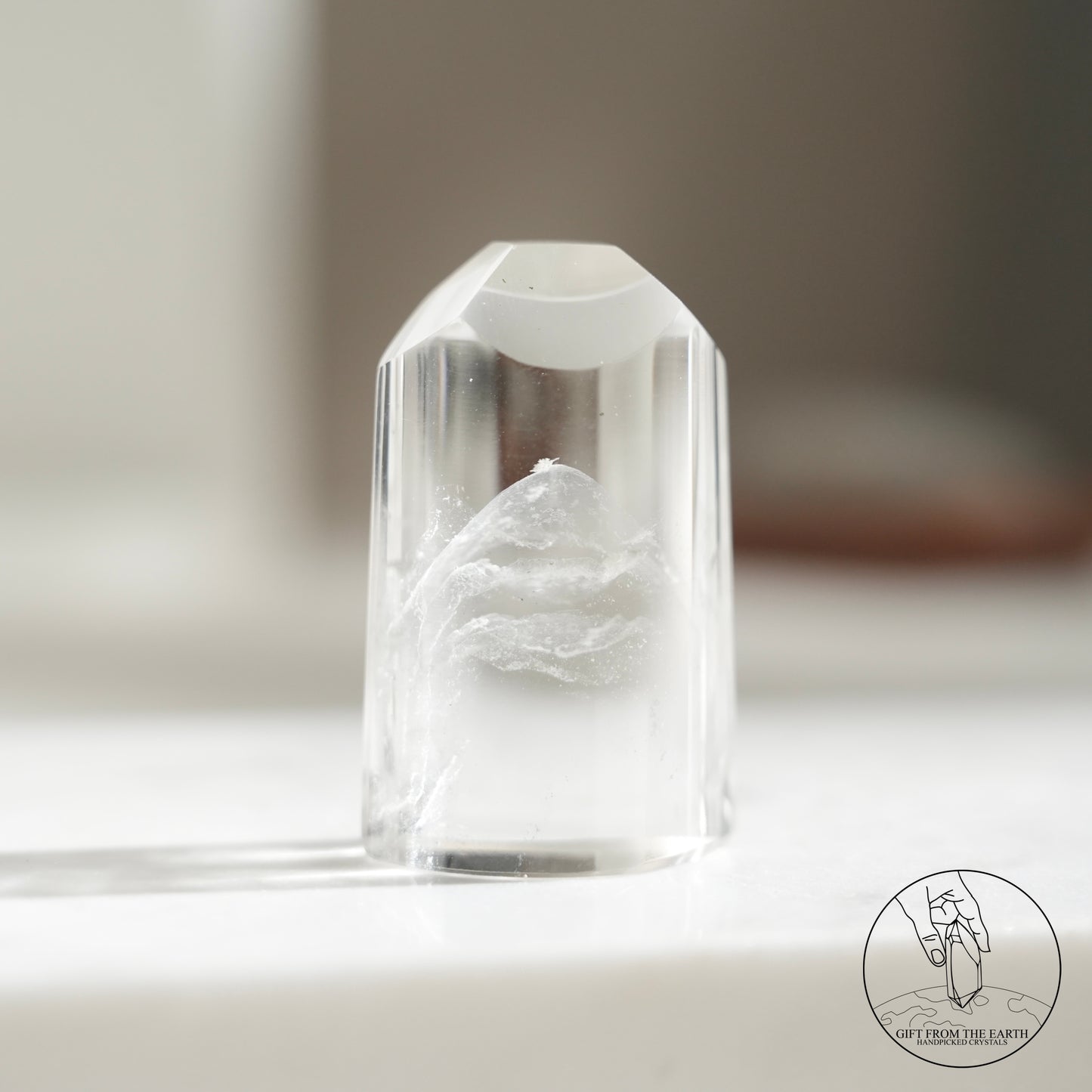 Half-polished multi-layered red-green phantom quartz point