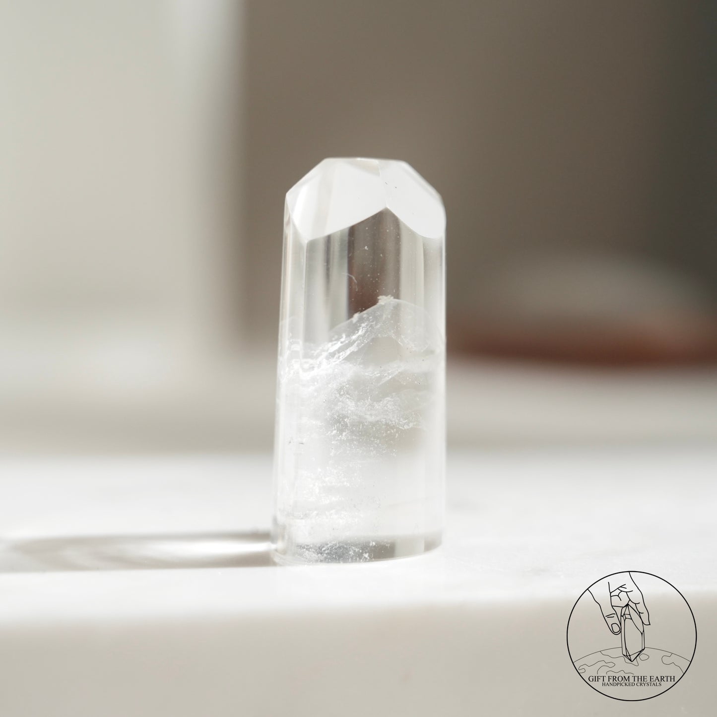 Half-polished multi-layered red-green phantom quartz point