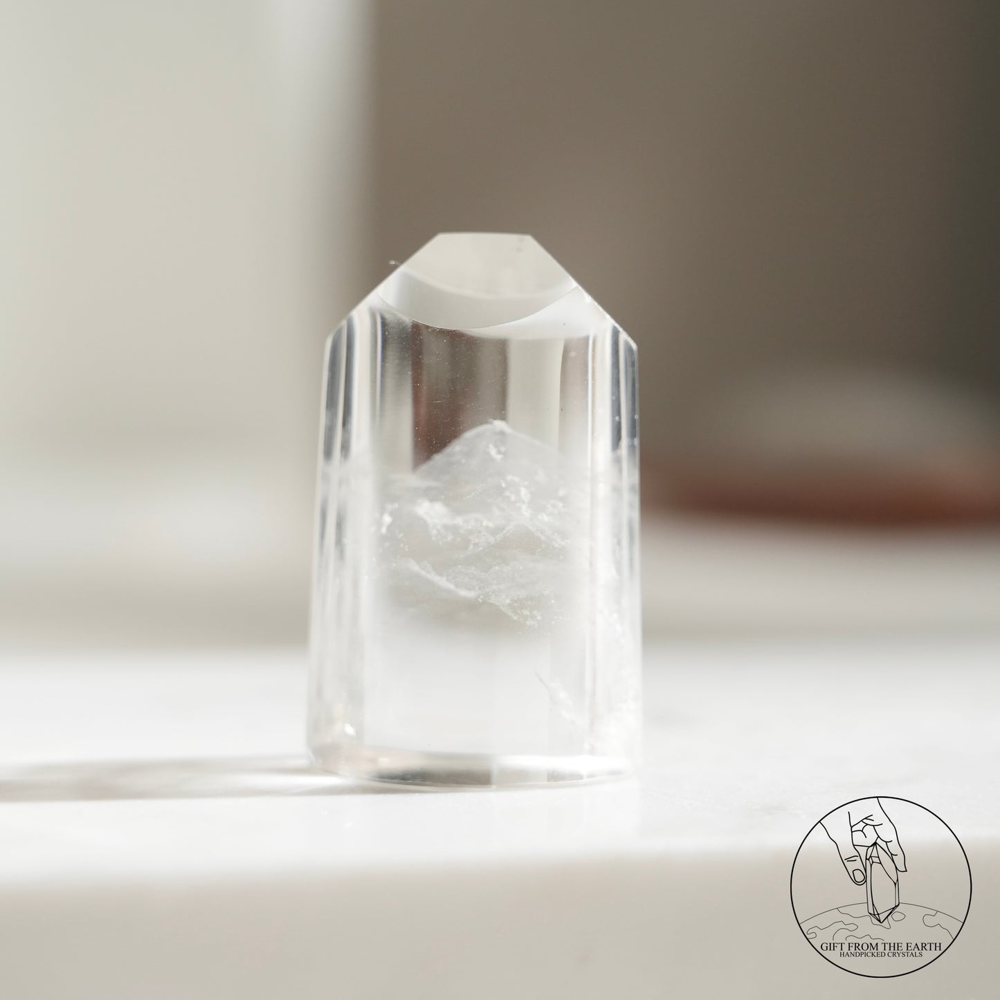 Half-polished multi-layered red-green phantom quartz point