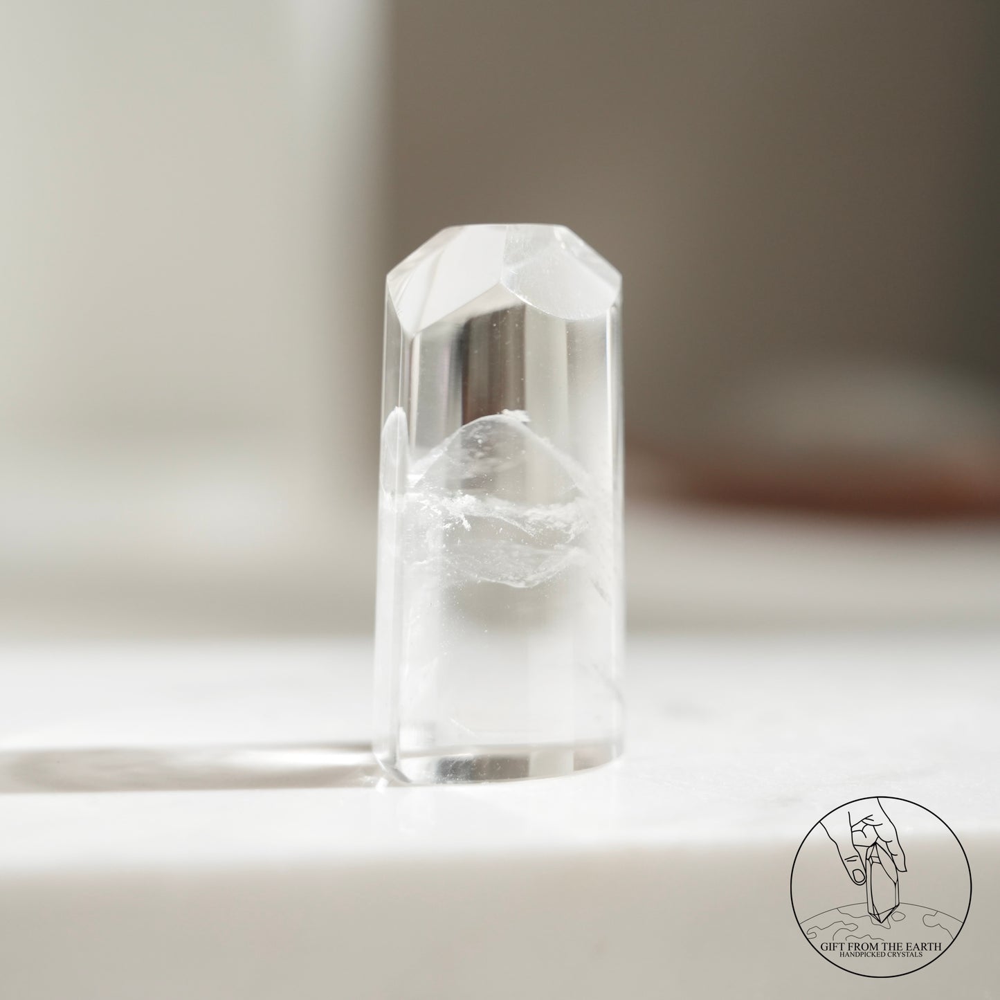 Half-polished multi-layered red-green phantom quartz point