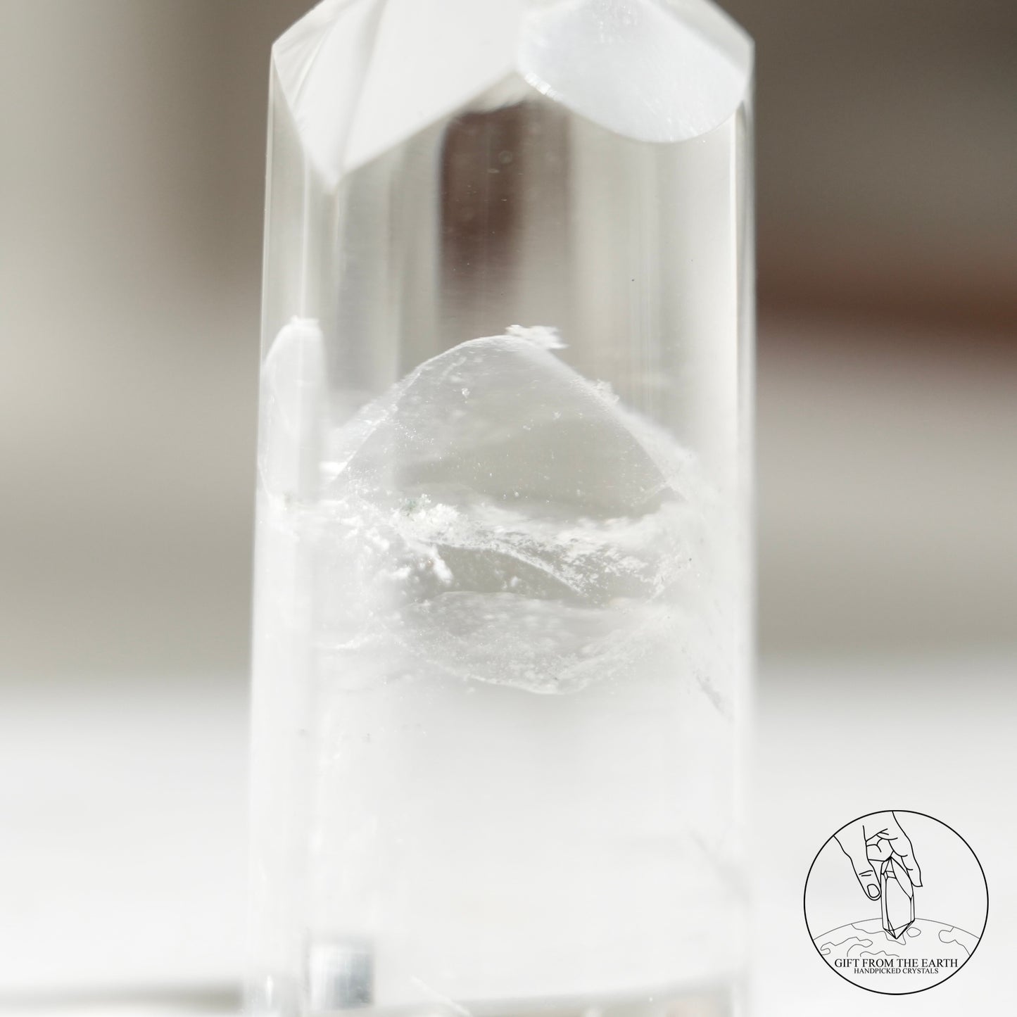 Half-polished multi-layered red-green phantom quartz point