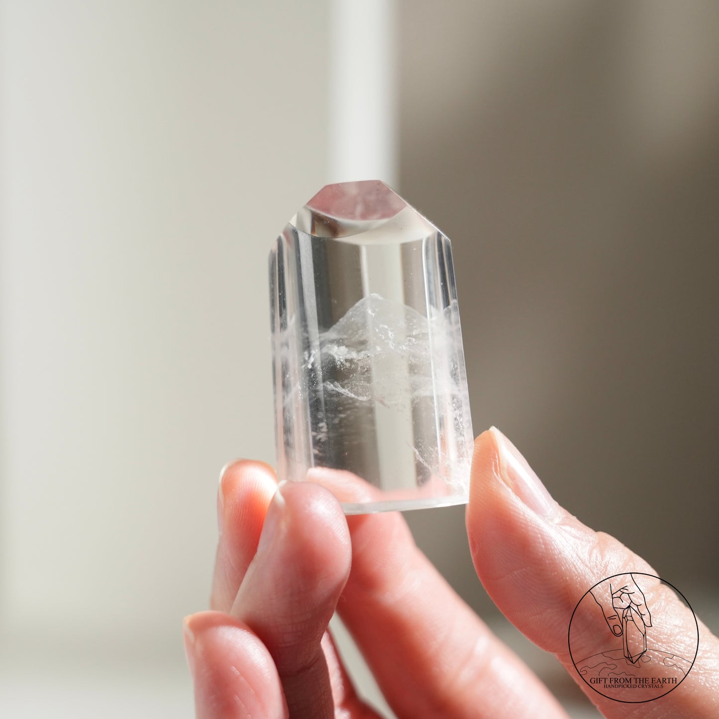 Half-polished multi-layered red-green phantom quartz point