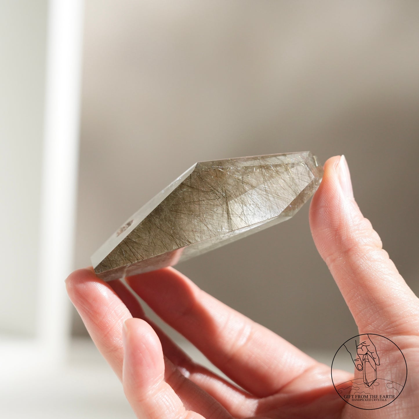 Green rutilated quartz sphere